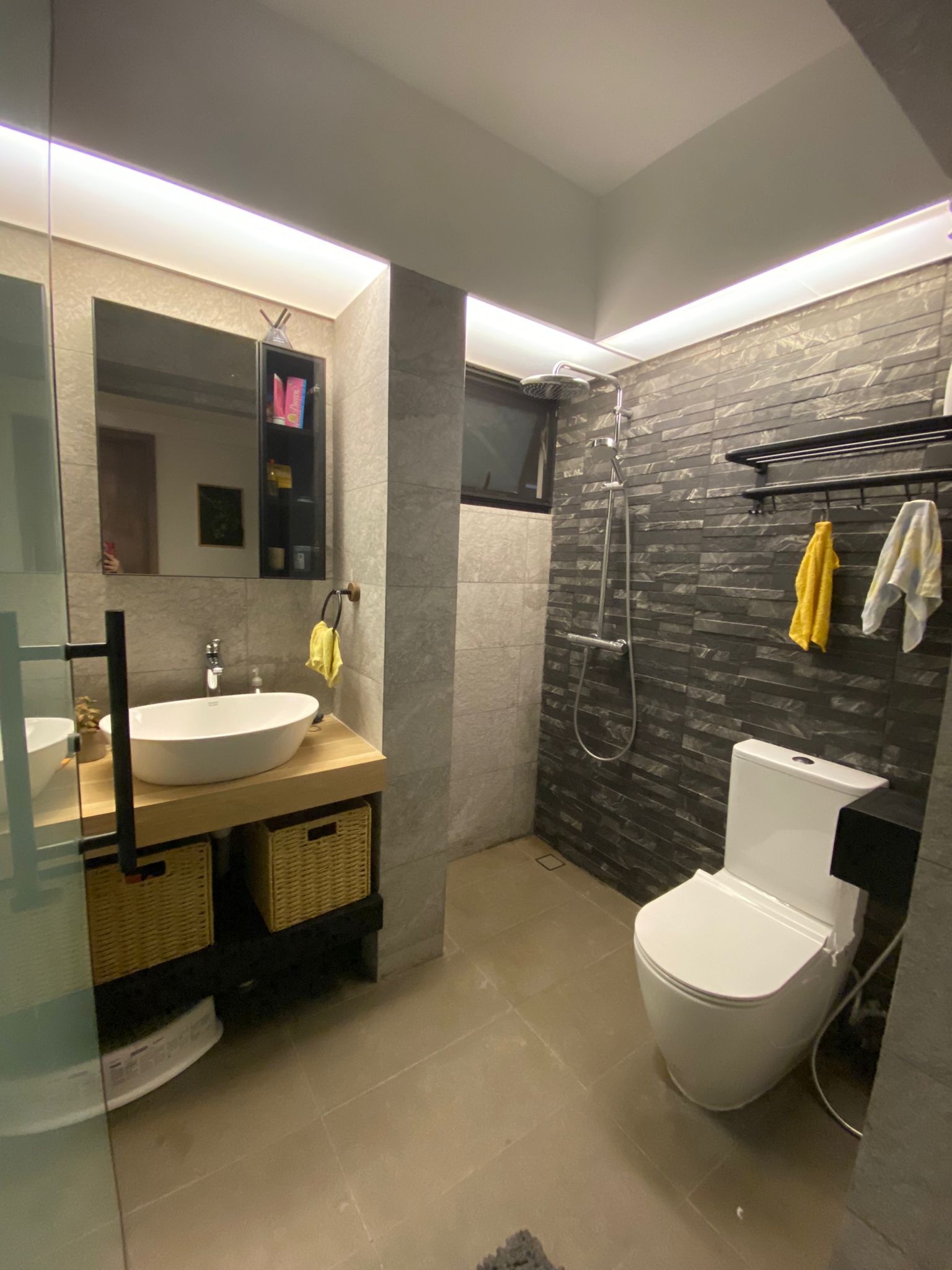 Our bathrooms: Resort-style relaxing sanctuaries - Modern bathroom with sleek design, large mirror, built-in sink, glass