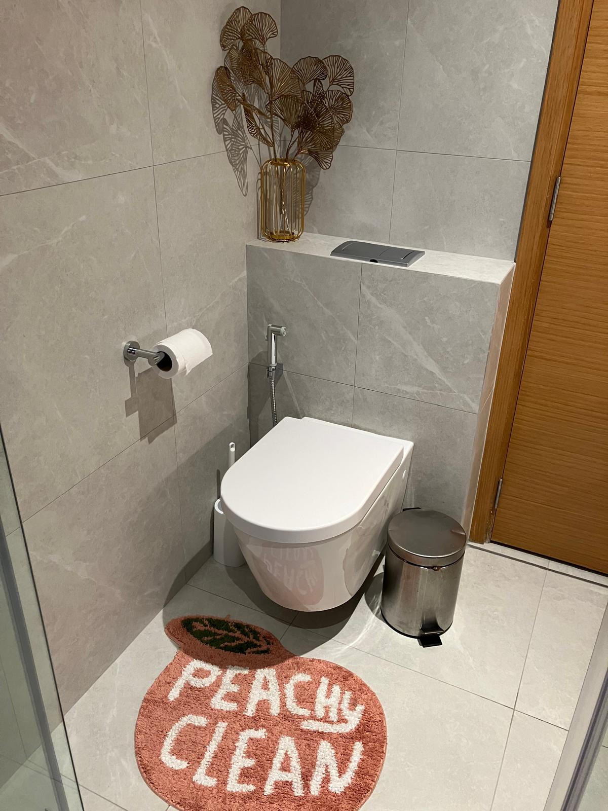 We had a bathtub but dumped it! 🛁 - Modern bathroom with sleek design, beige marble tiles, white toilet, glass shower