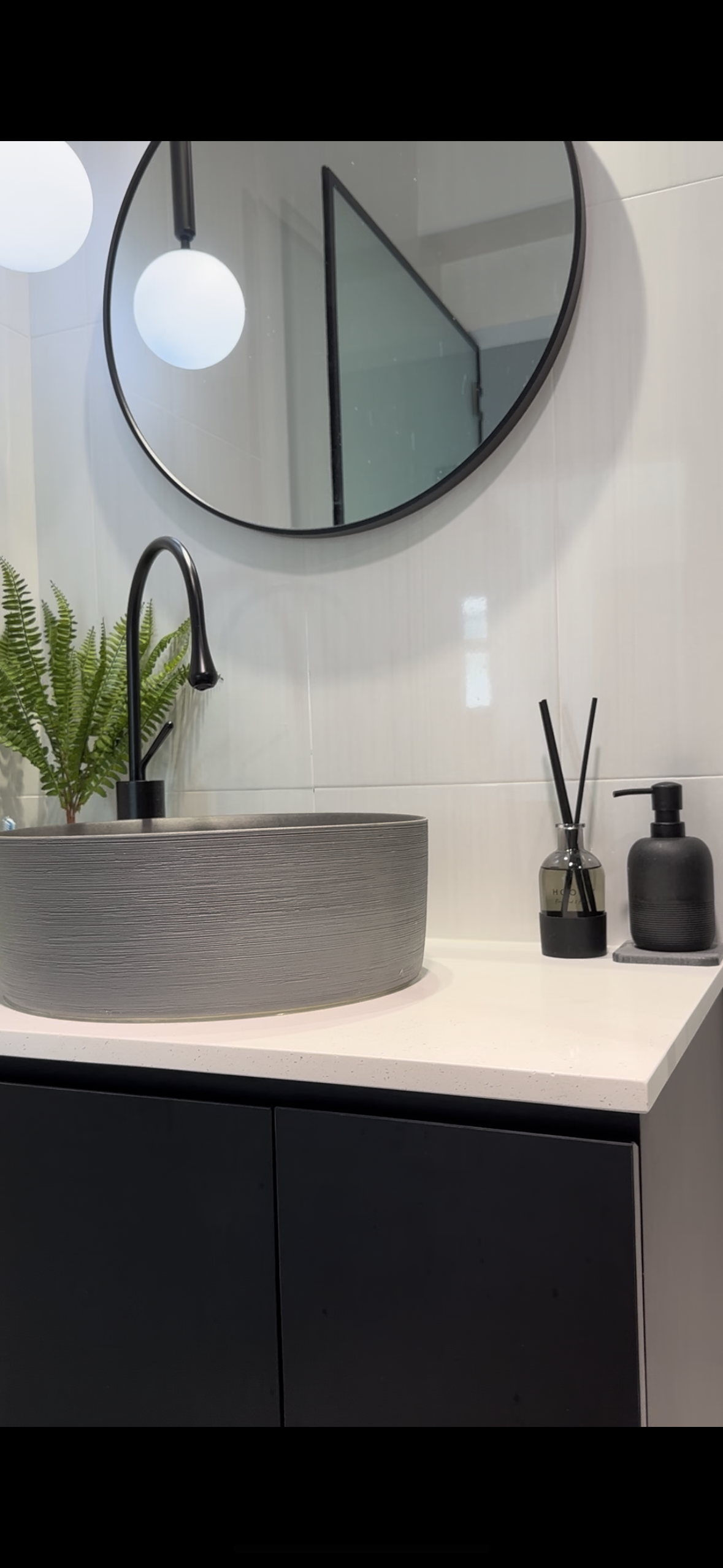 A modern, cozy toilet that invites and motivates. - modern bathroom vanity, sleek sink, black faucet, minimalist design