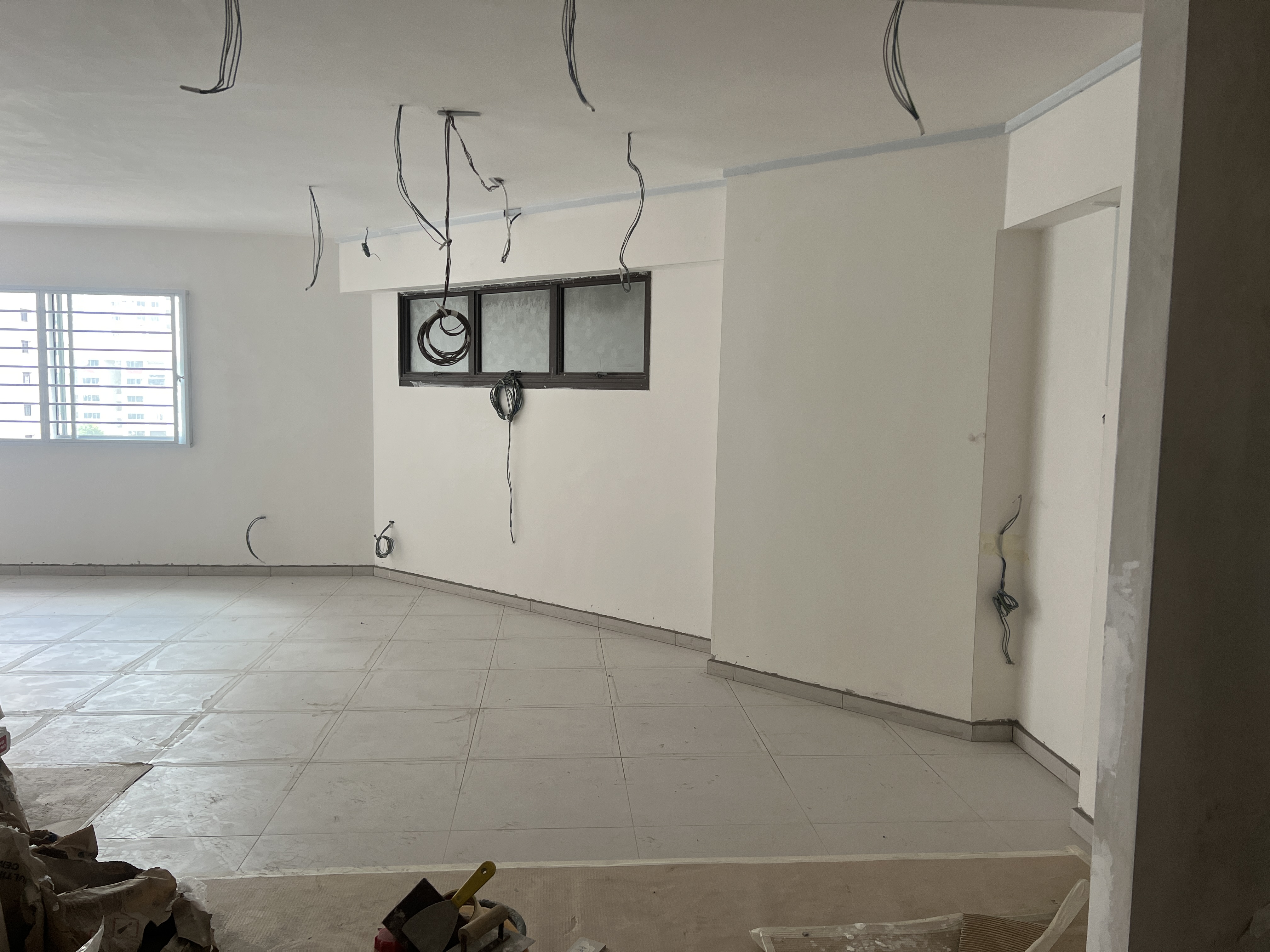 House-Hunting: Becoming Bishanhomies - Empty room with unfinished walls and tiled floor, Construction site with exposed