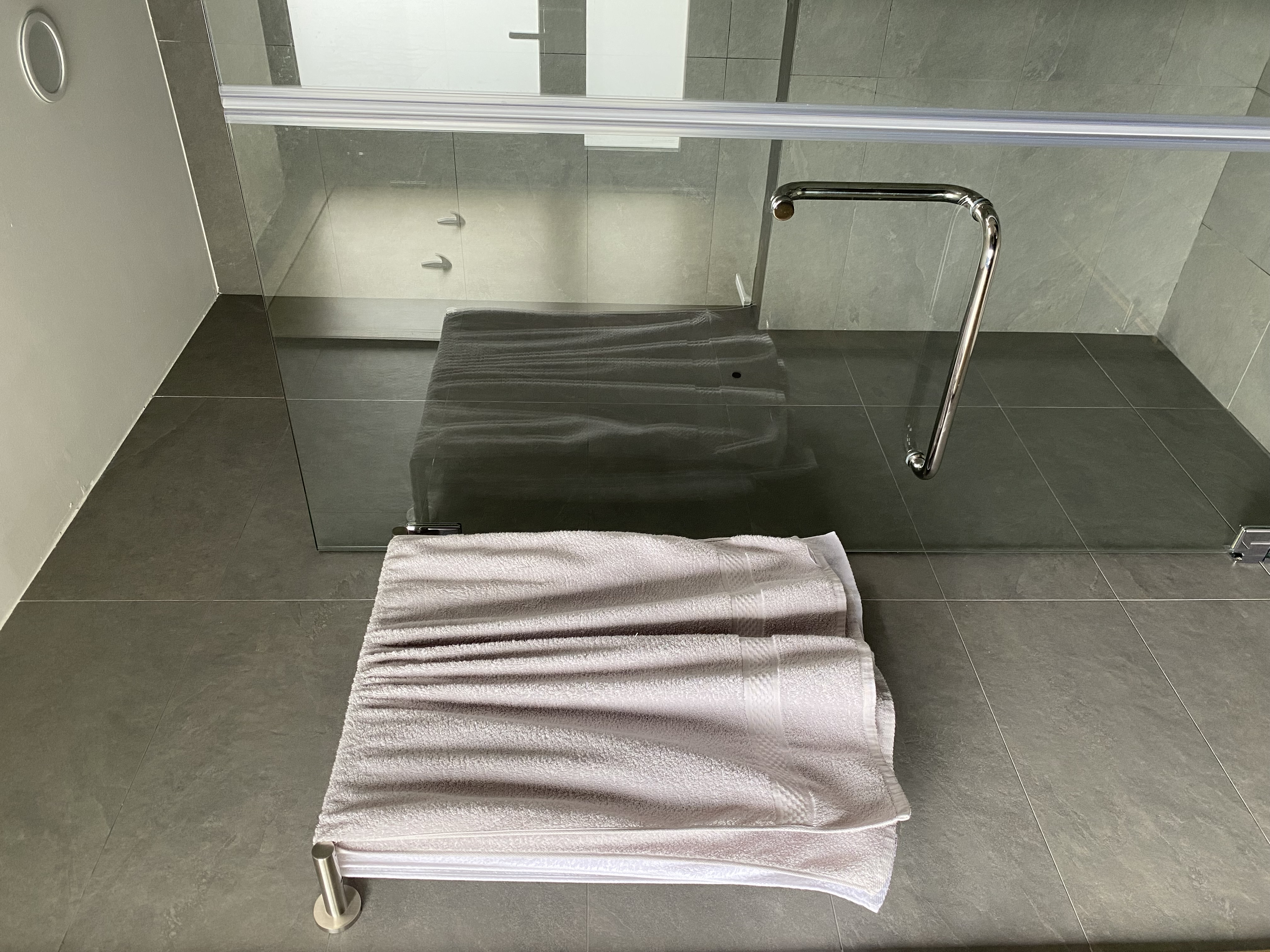 Moody and textured bathrooms in 50 shades of grey - modern bathroom, glass shower enclosure, sleek design, gray tiles