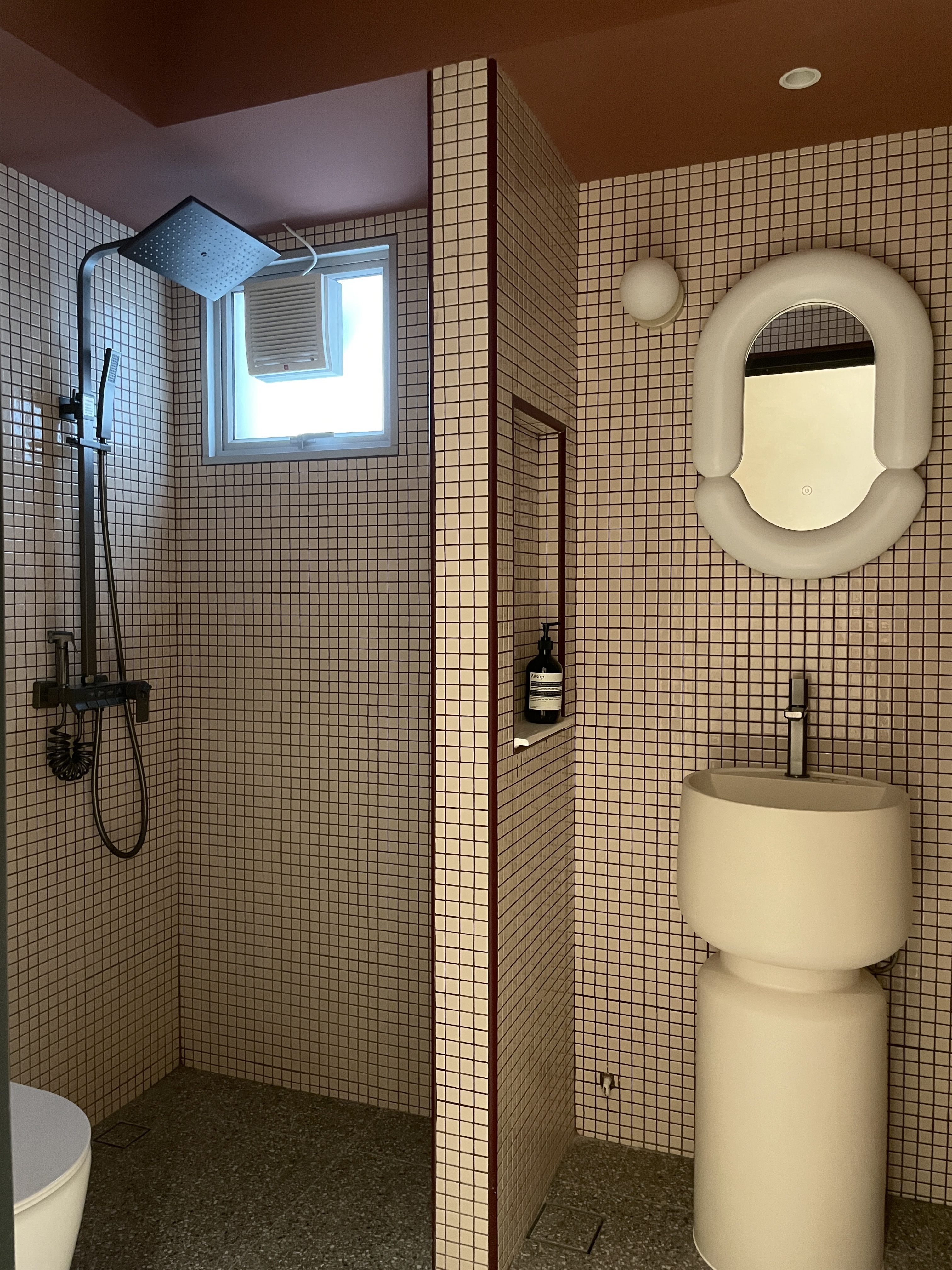 Mosaic Bathroom: Bold and Quirky with Retro Vibes and Modern Flair - Modern bathroom with beige and brown tiles, freestanding