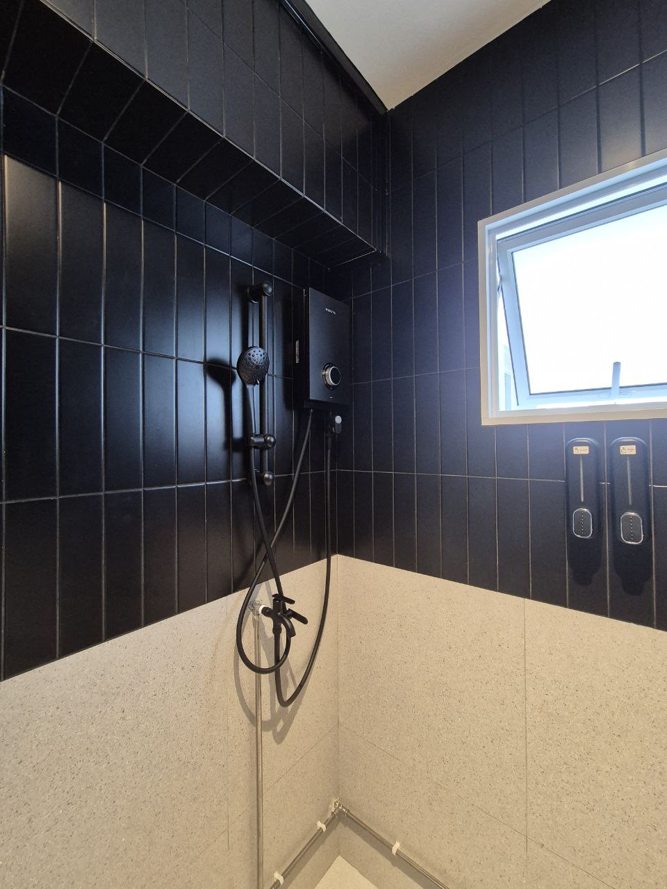 Bathroom Battle - Gunmetal vs Matte Black - Black tiled wall, showerhead, handheld shower, black shower fixture, window above