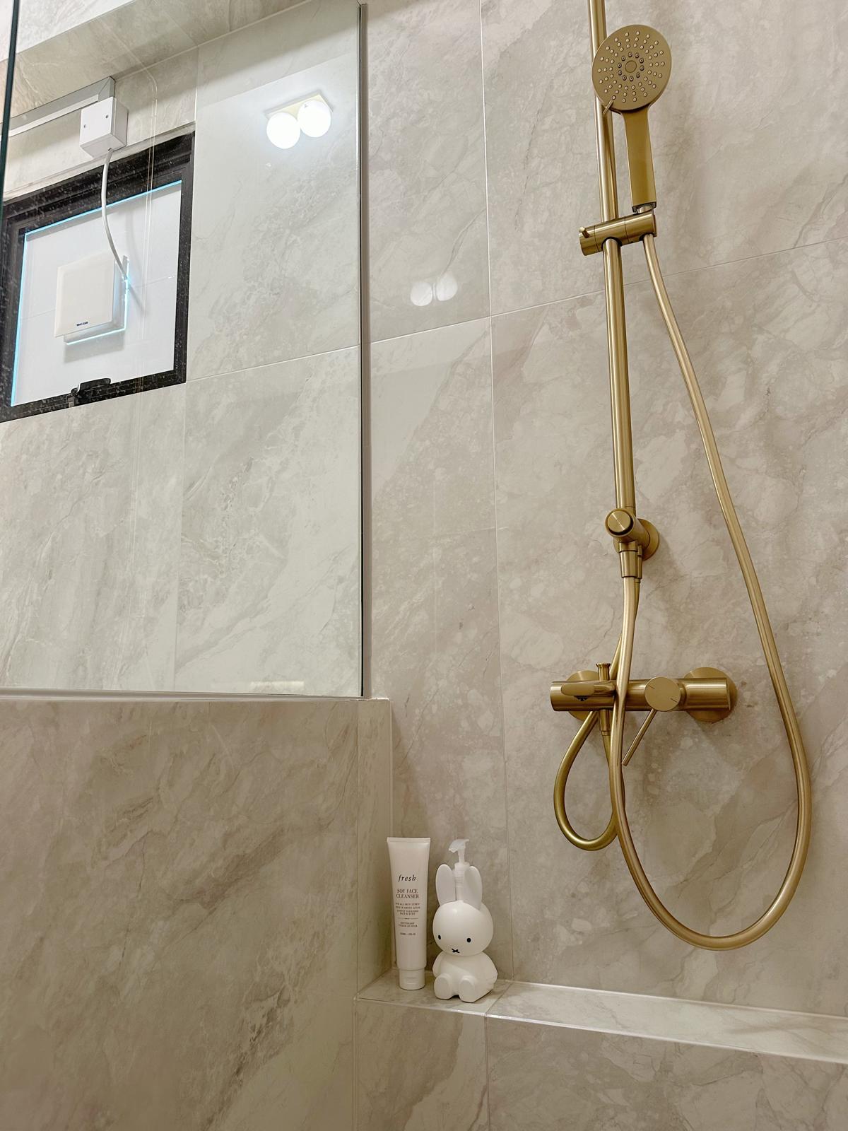 Master bath: Recreating the luxe hotel experience (w a hidden feature) - gold shower head, marble tiles, modern bathroom