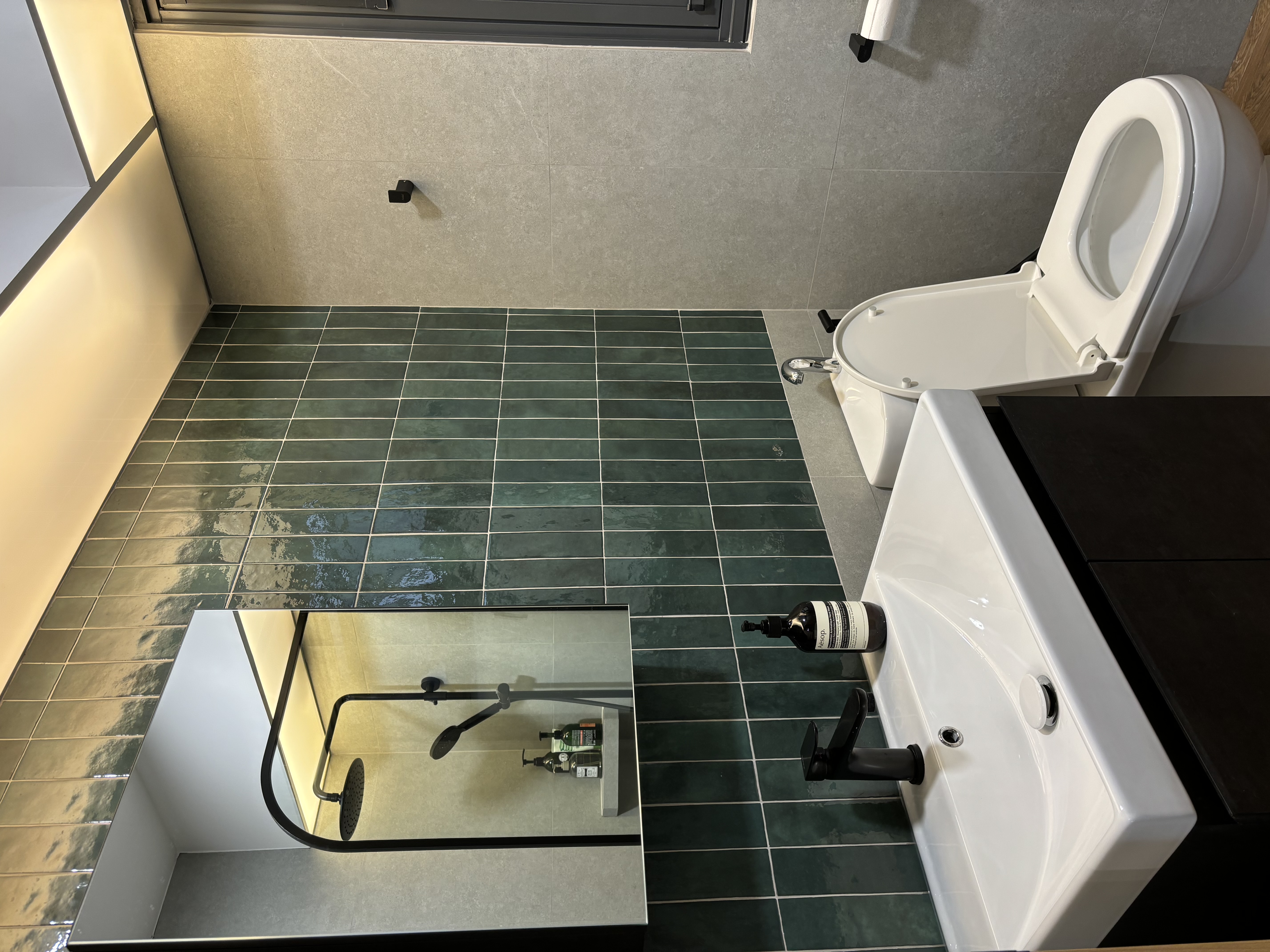 Best of both worlds: 2 differently-styled bathrooms - Modern bathroom interior, sleek design, gray tiles, green tiles, white