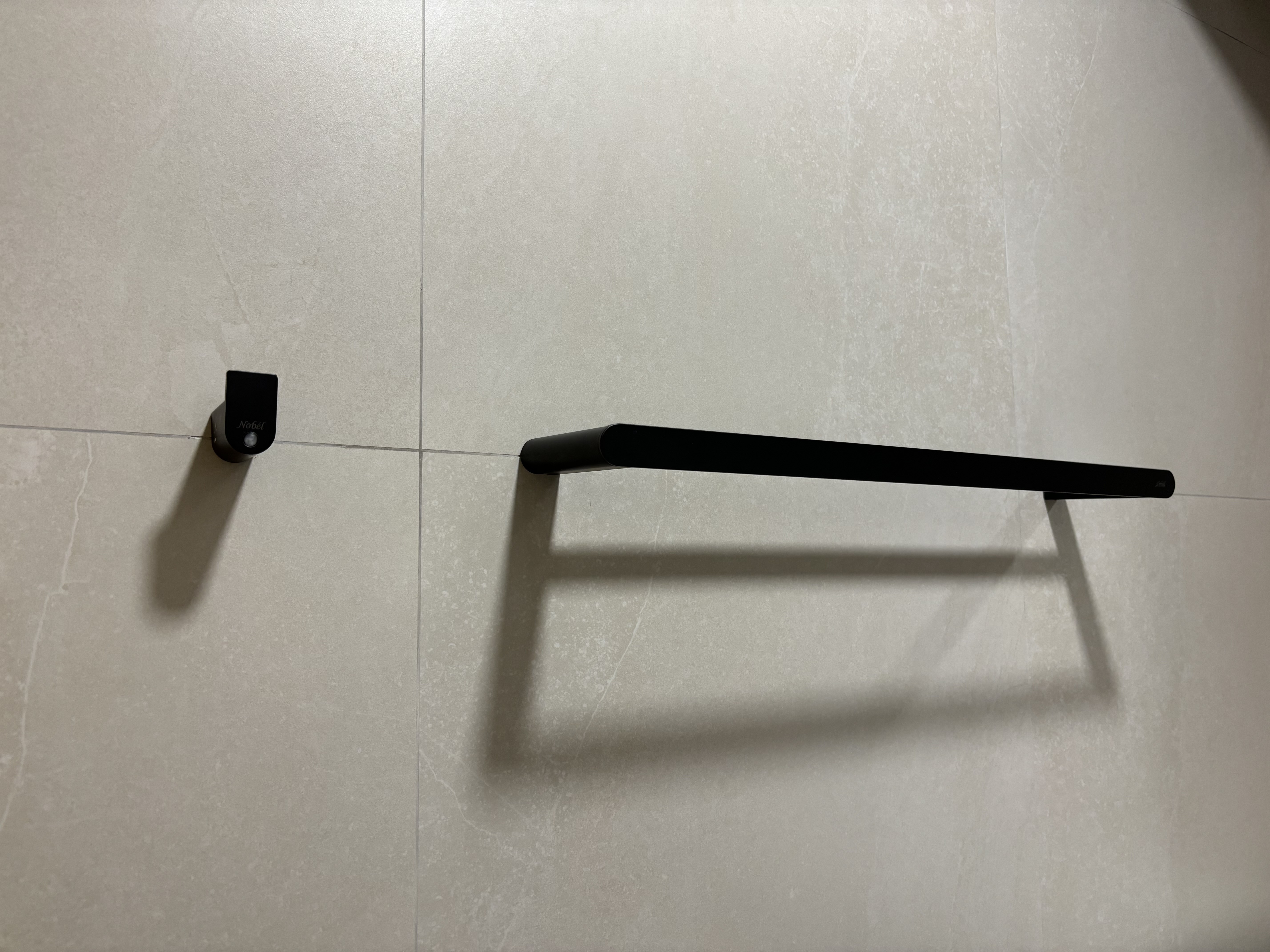 Best of both worlds: 2 differently-styled bathrooms - Floor-standing security camera, black metal frame, minimalist design