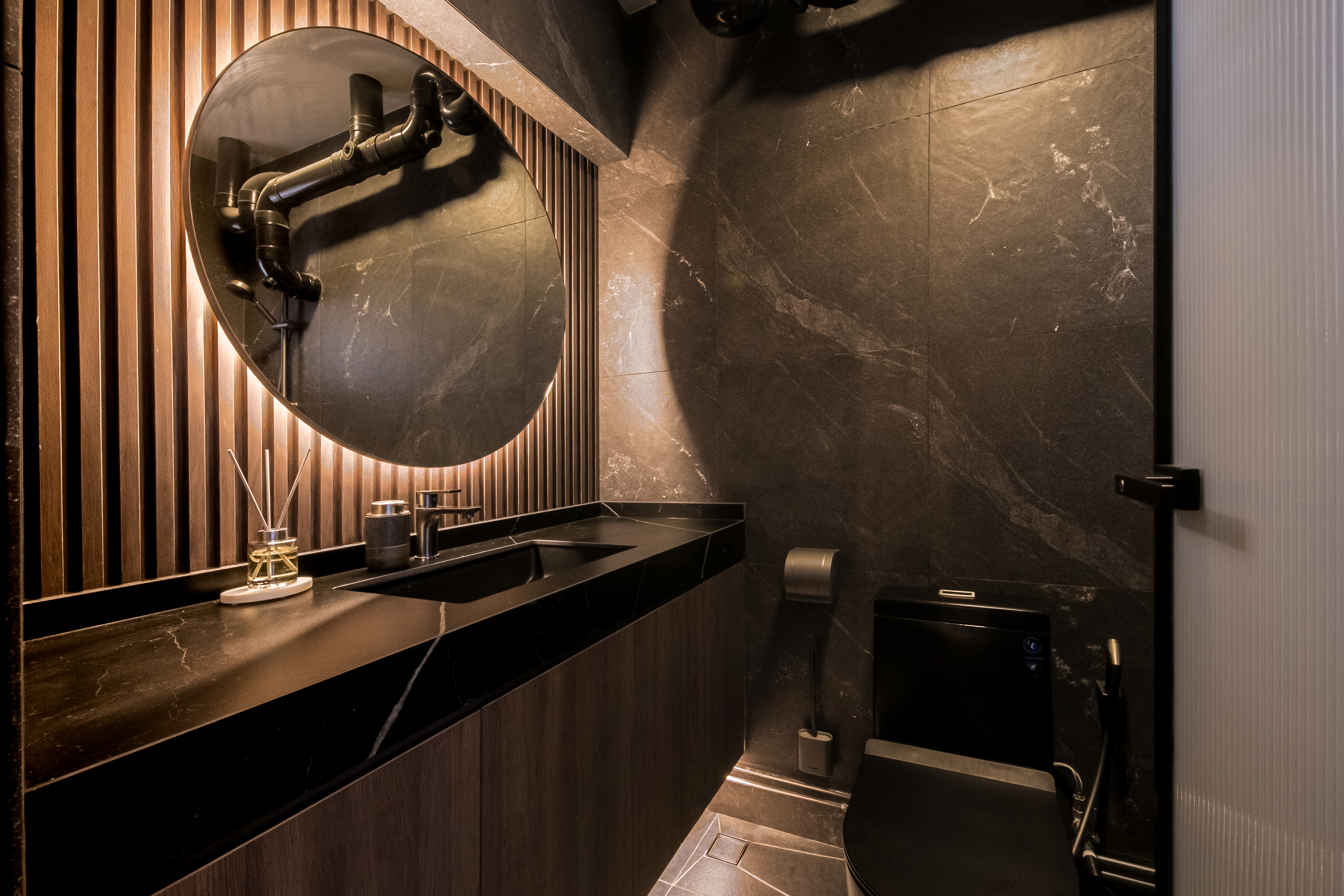 Modern Elegance in the Bathroom: A Blend of Style and Function - Modern bathroom with sleek design, dark wood paneling, black