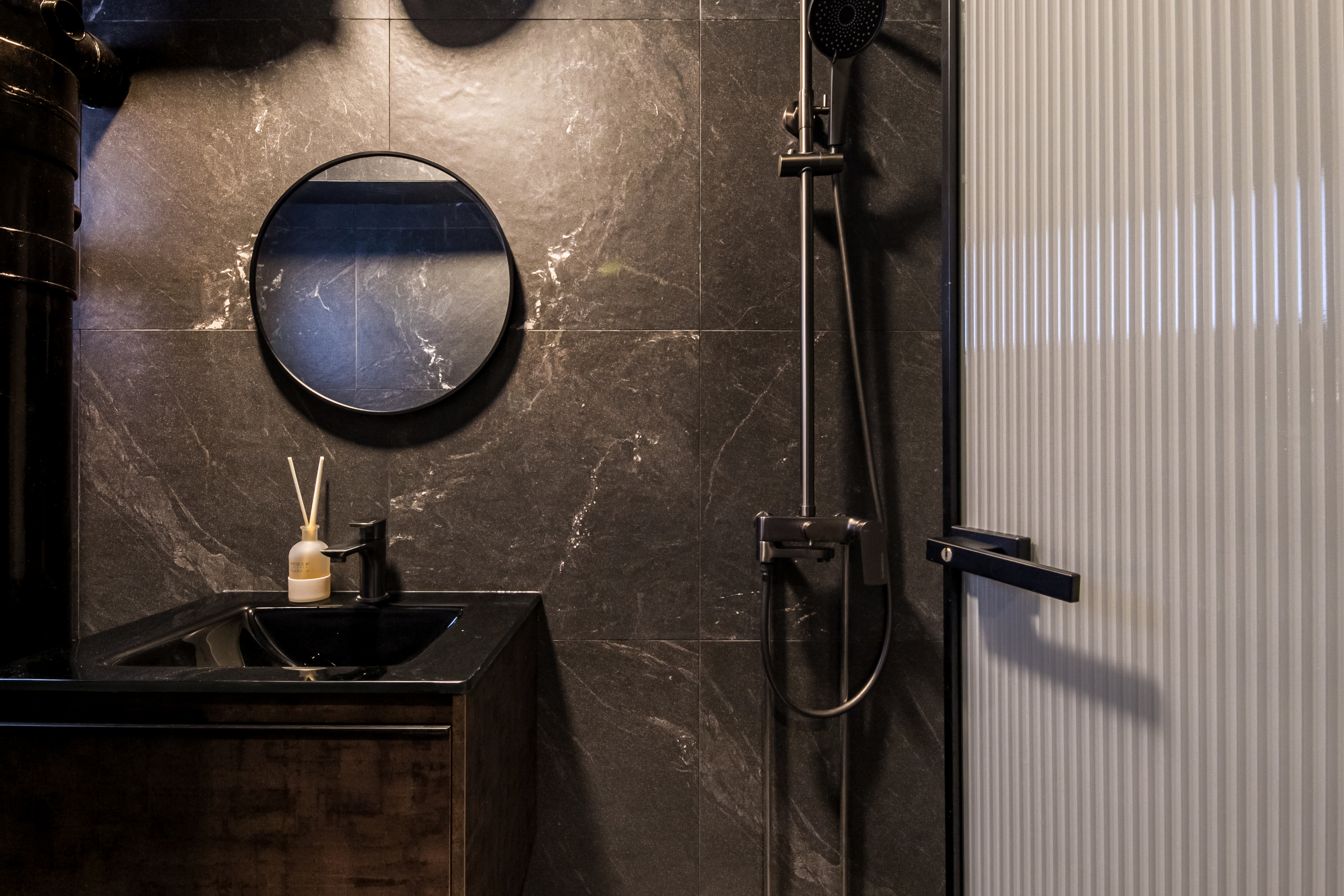 Modern Elegance in the Bathroom: A Blend of Style and Function - Dark marble bathroom, modern design, black sink, black