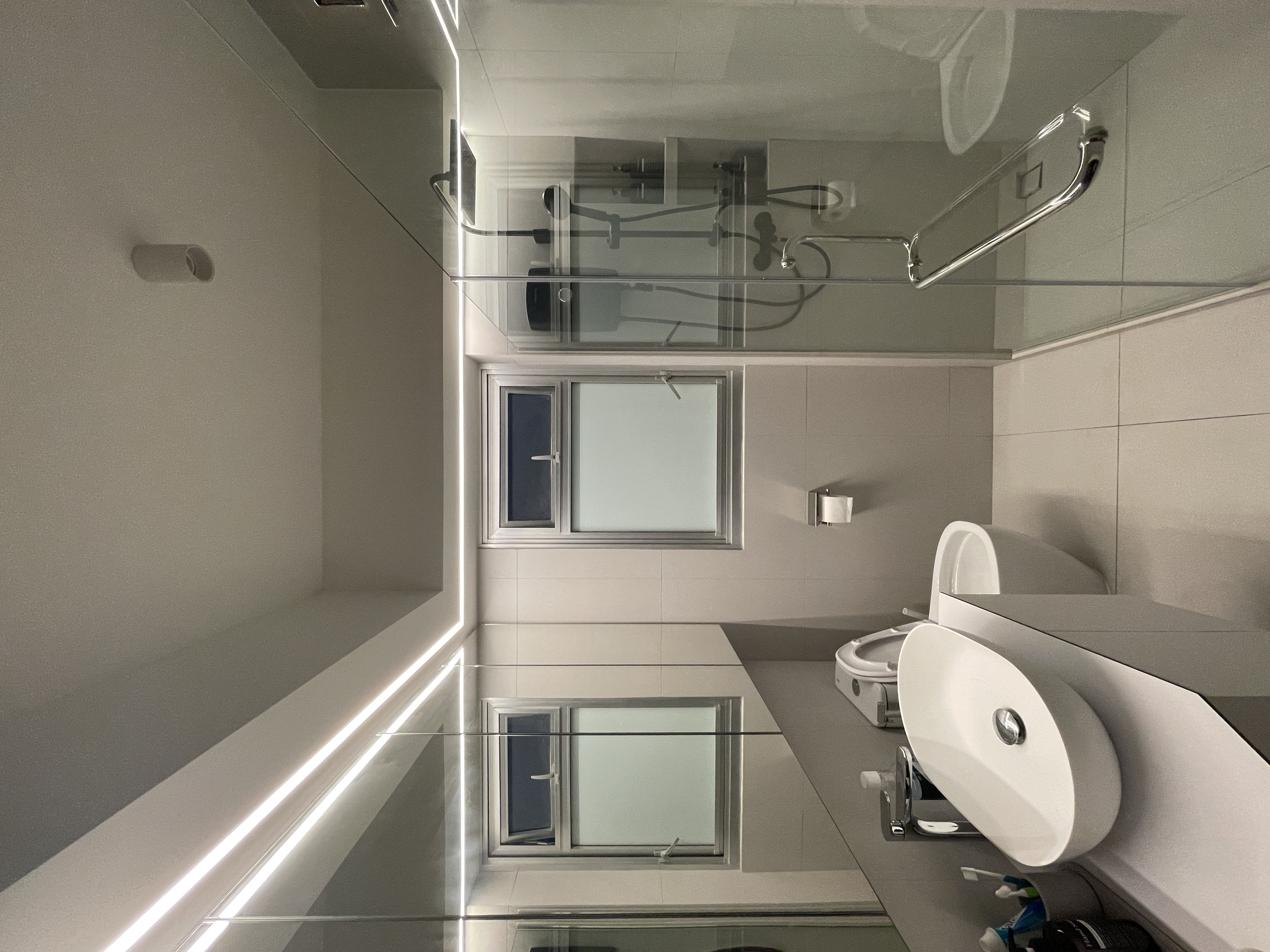 Elevate Your Space: Hotel-Inspired Bathrooms Transformation - Modern minimalist bathroom, sleek design, large window, glass