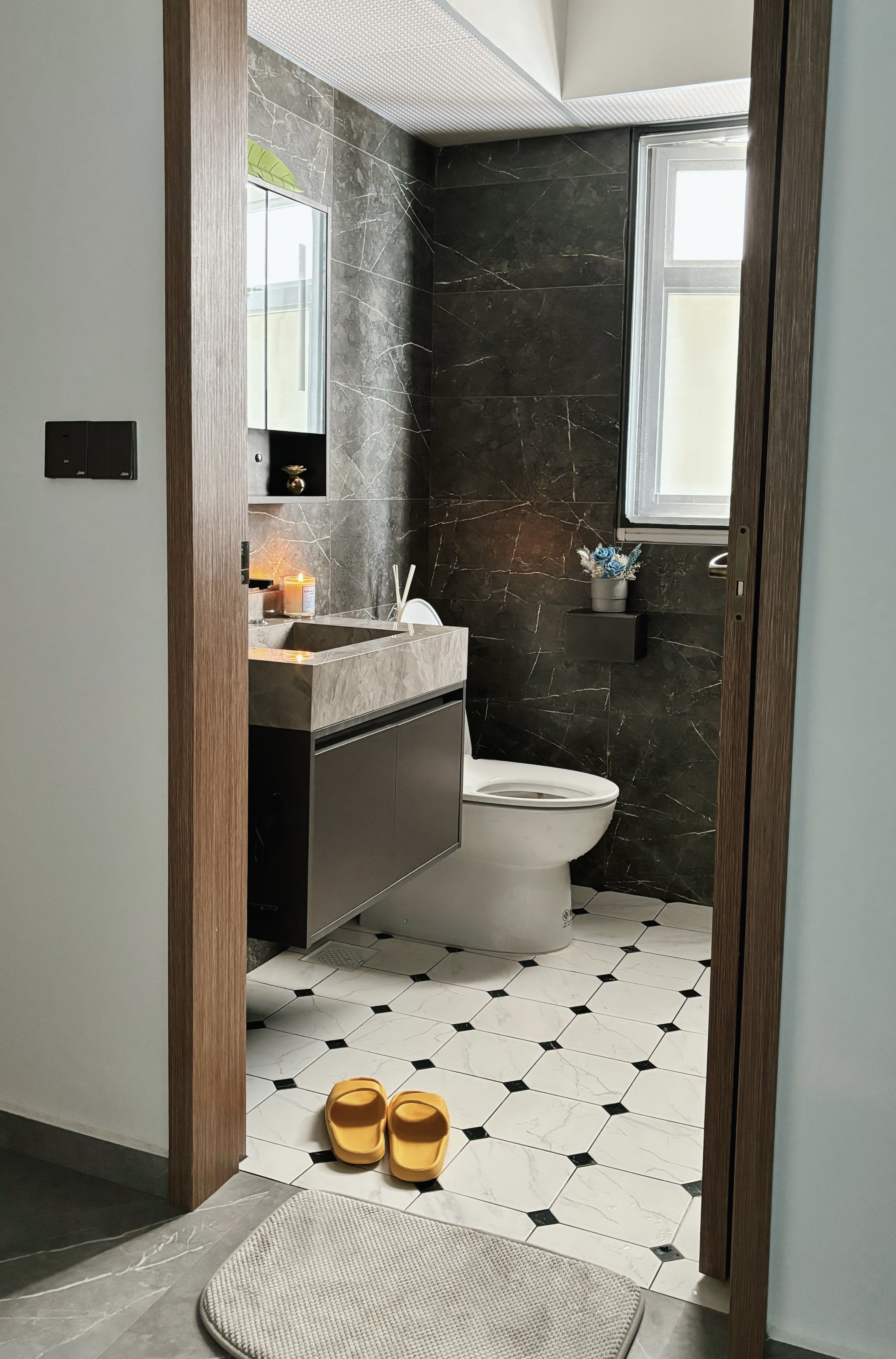 Refined and Modern: Our Master Bath Scene - Modern bathroom interior, minimalist design, dark marble walls, white toilet