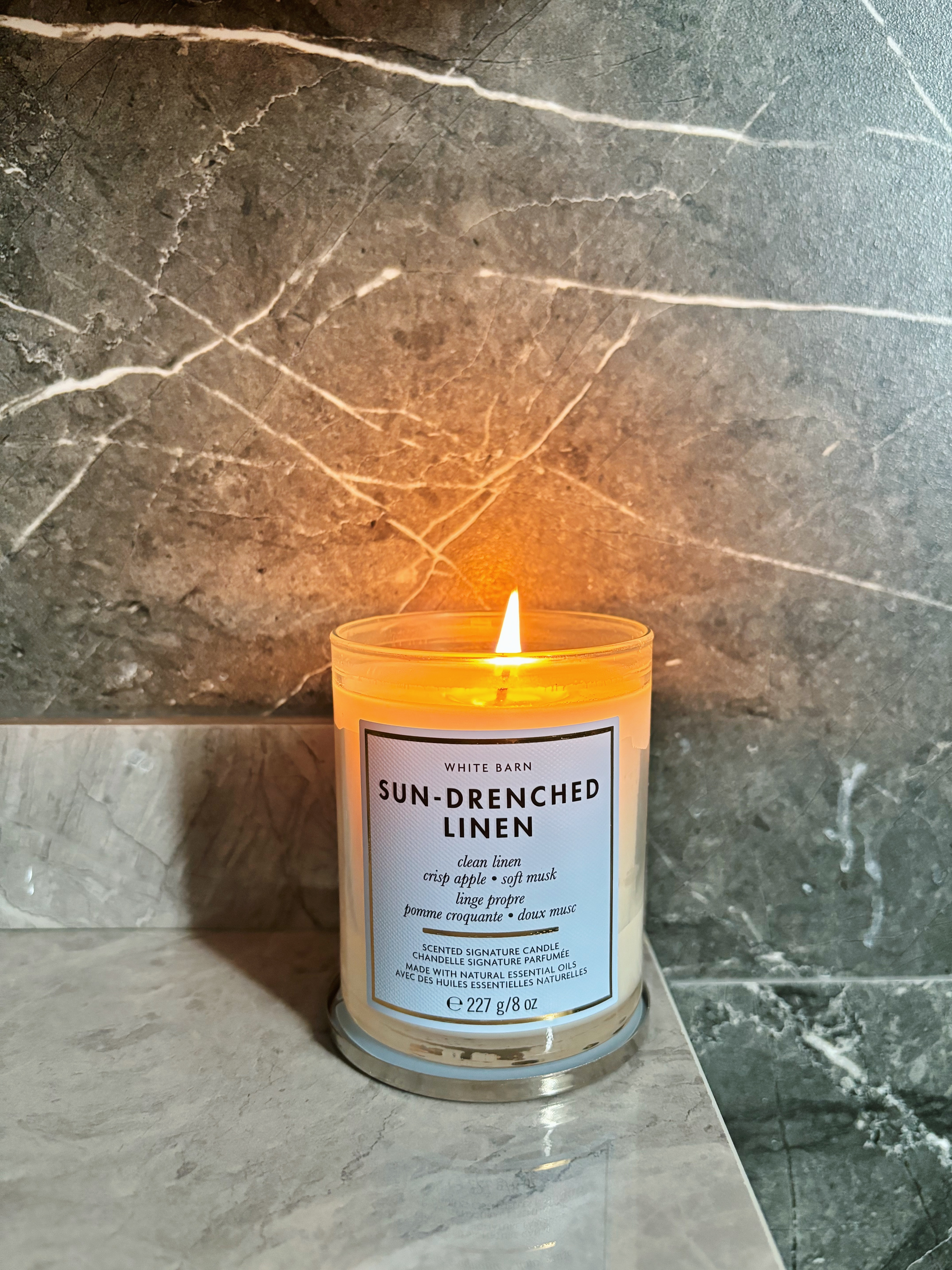 Refined and Modern: Our Master Bath Scene - Sun-drenched linen scented candle, white barn brand, clean linen, crisp apple
