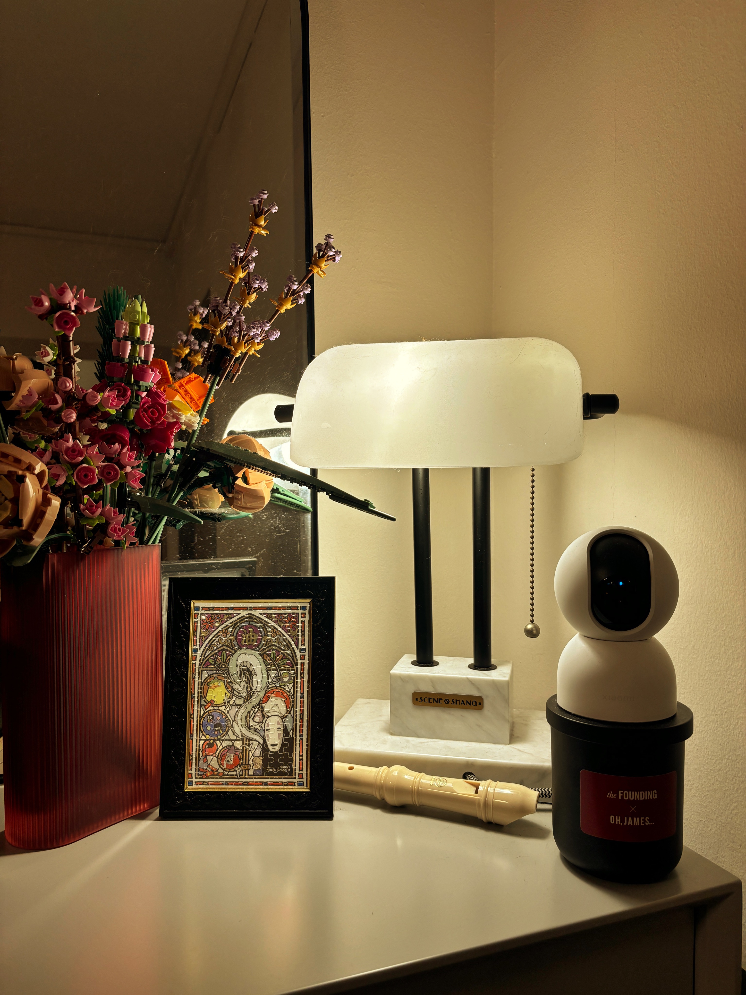6 types of Ambient Lights for Cosy Vibes  - vibrant floral arrangement, white robot, colorful artwork, red vase, black lamp