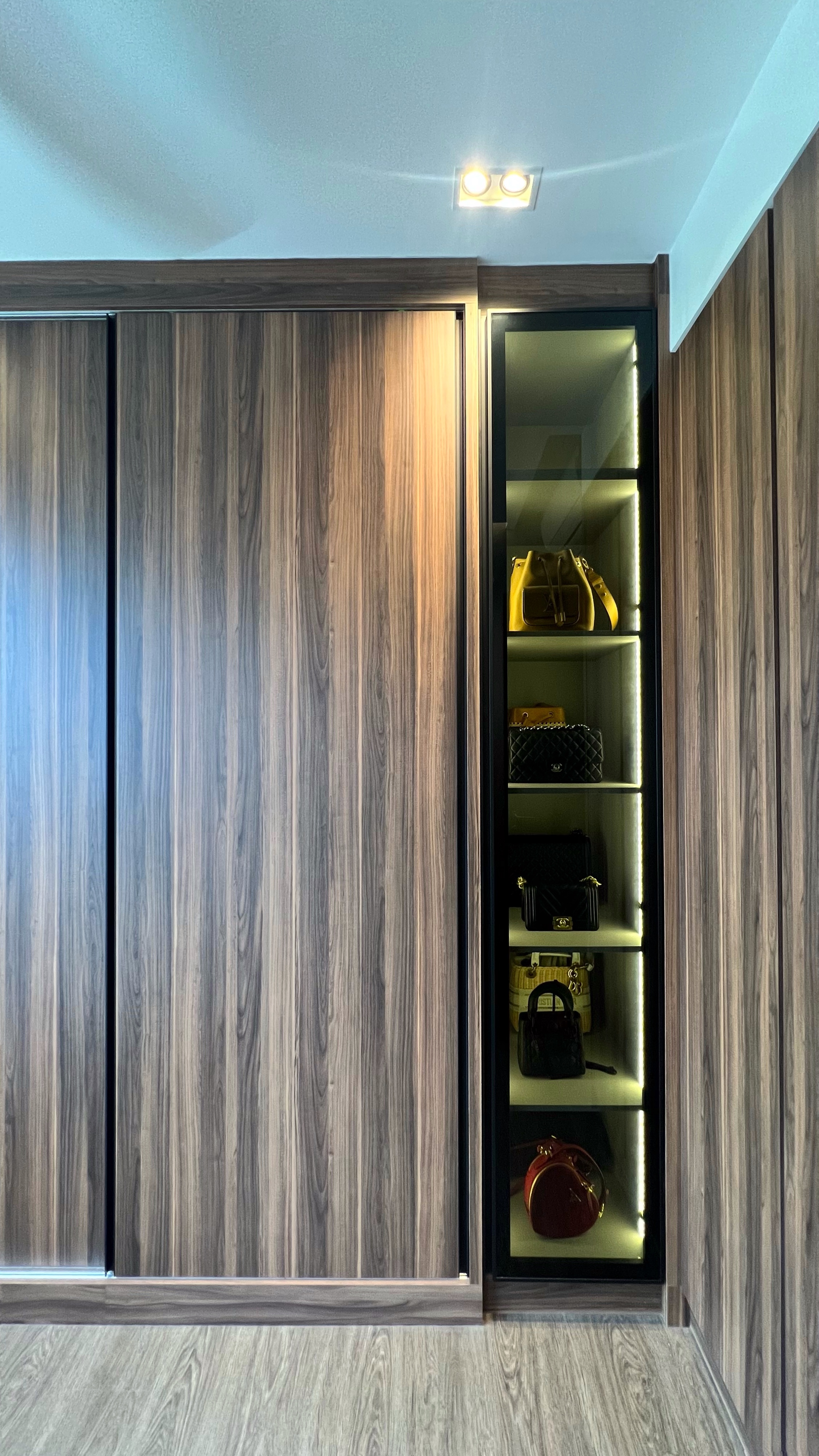 Transforming Spaces: From Wardrobe Sanctuary to Workout Haven - Wooden wardrobe with glass doors, sleek design, modern