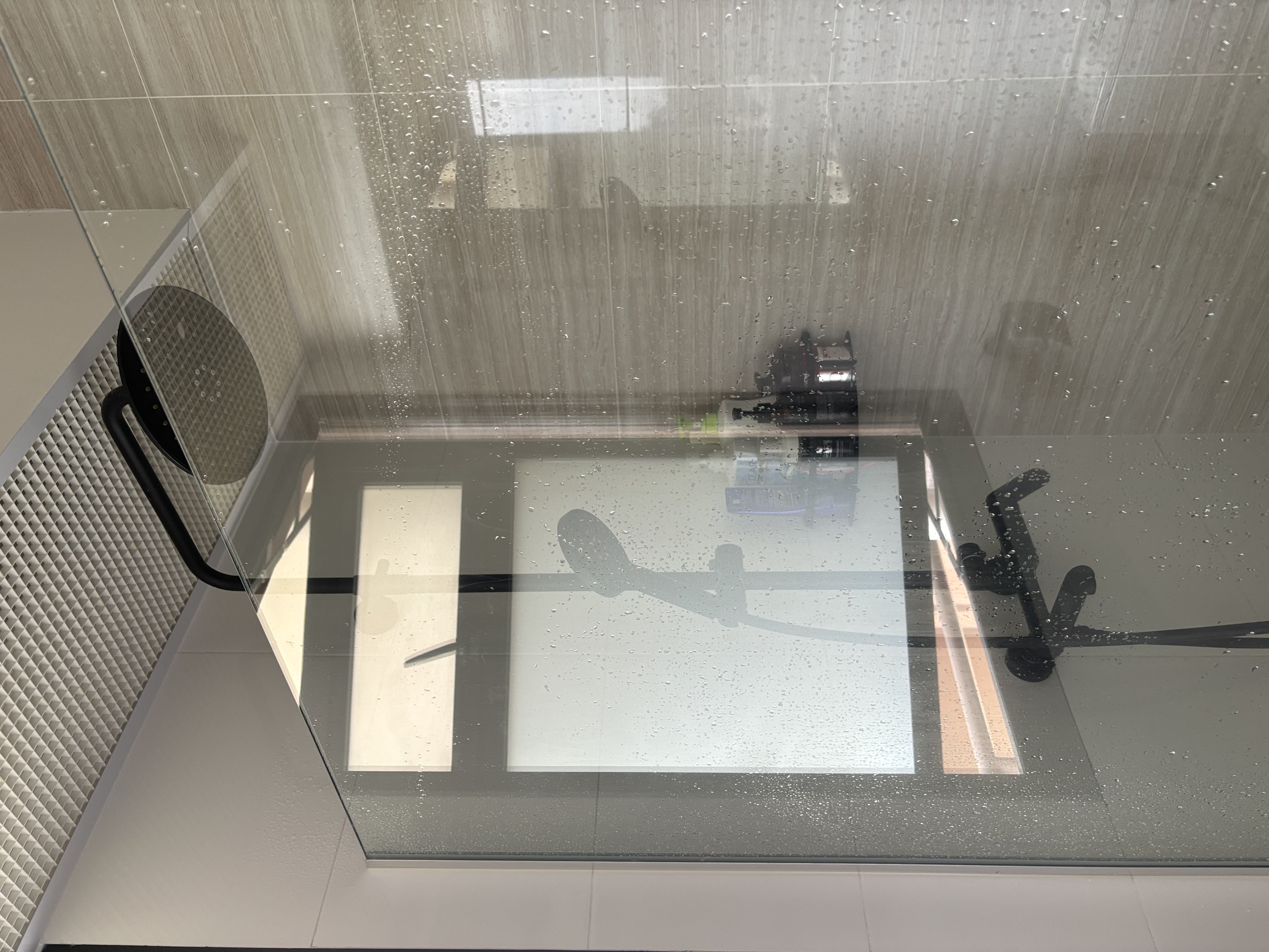 Minimal Bathroom without Breaking the Bank - Glass shower enclosure, raindrops on glass, indoor shower, modern design