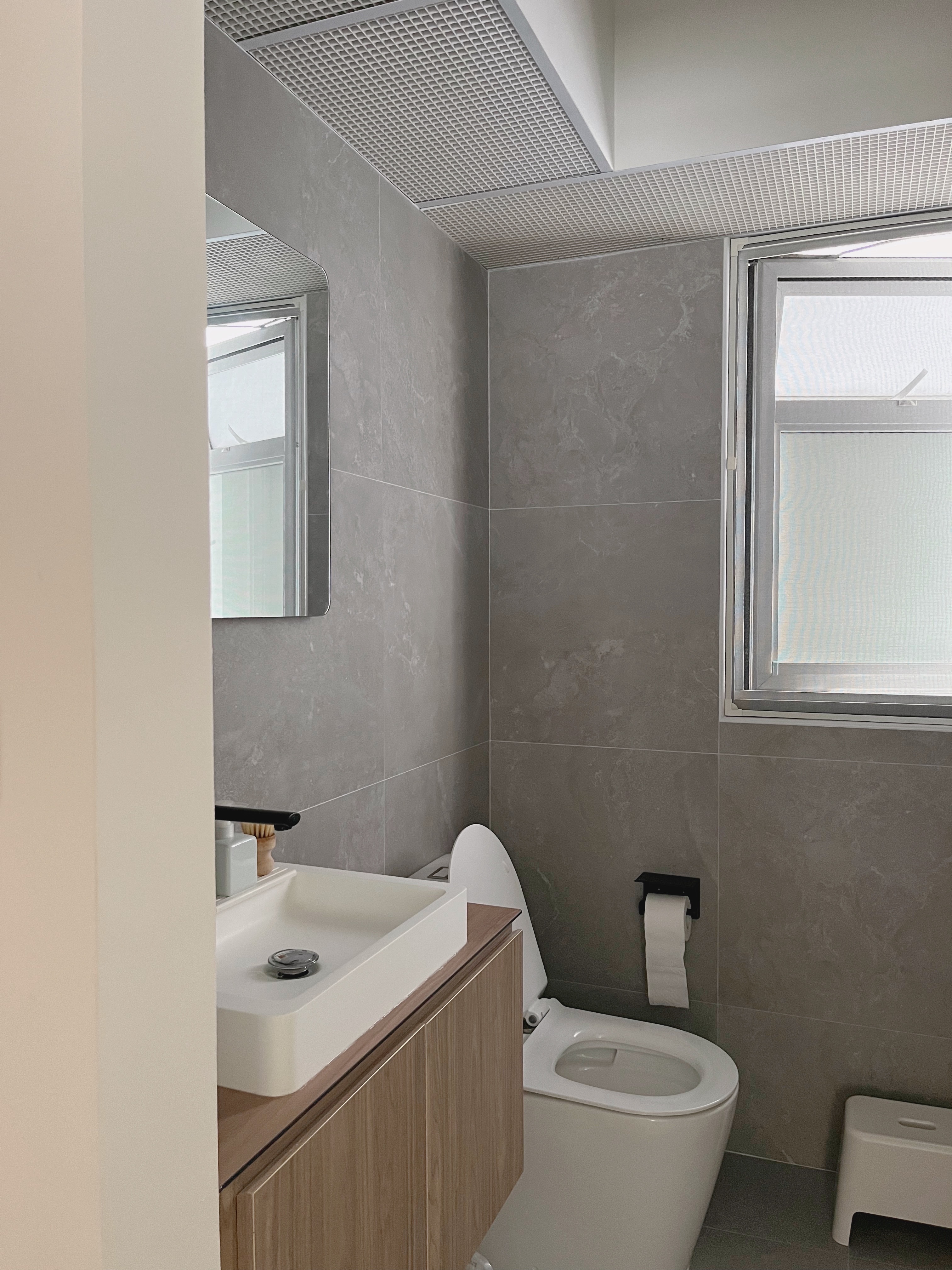 Upkeep of bathroom fittings - Regrets - Grey marble tiles, modern design, sleek sink, white toilet, wooden vanity, mirror