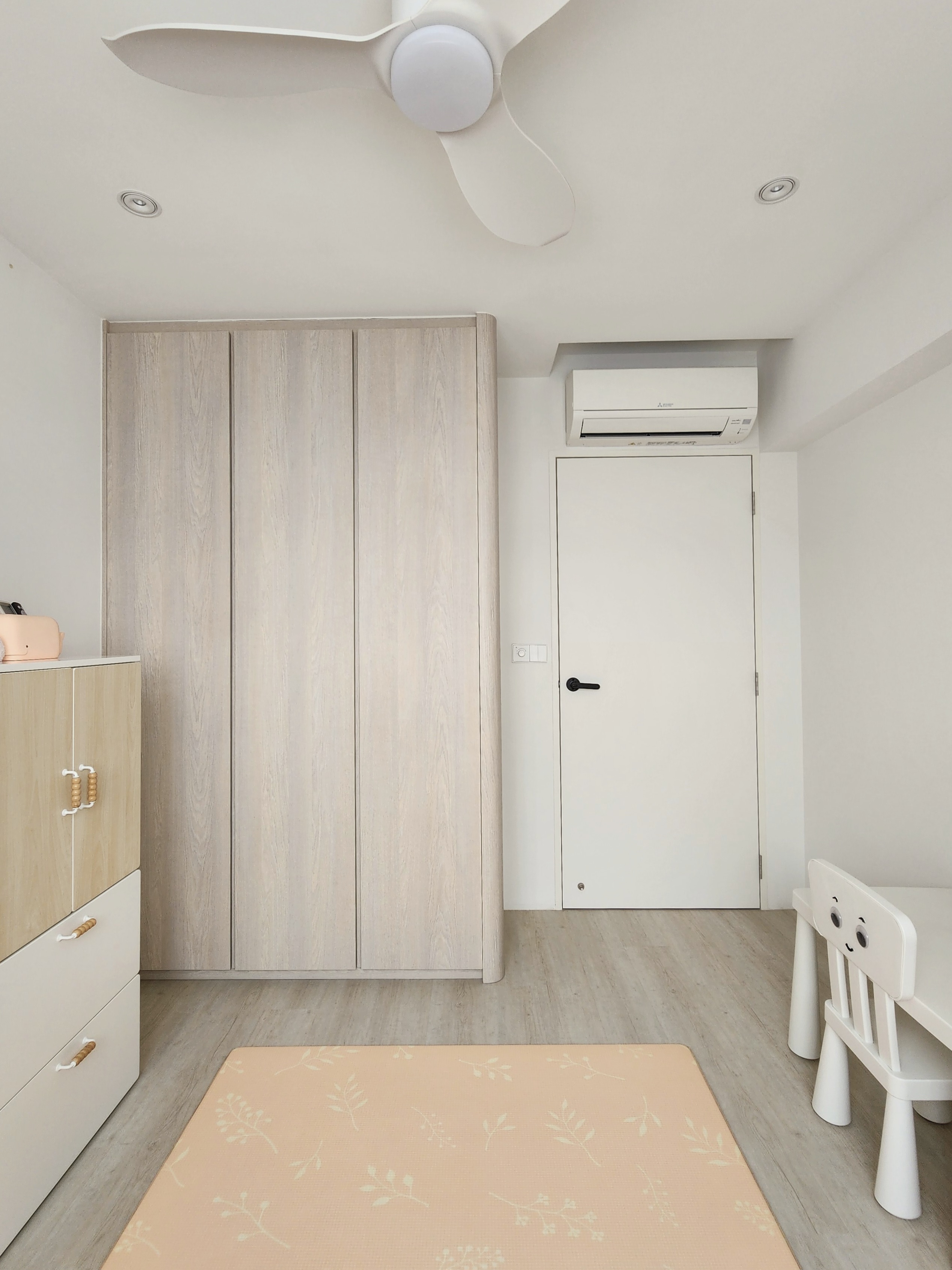 Our Kids Playroom: Where Fun Never Ends - Wooden wardrobe, light-colored walls, ceiling fan, recessed lighting, white door