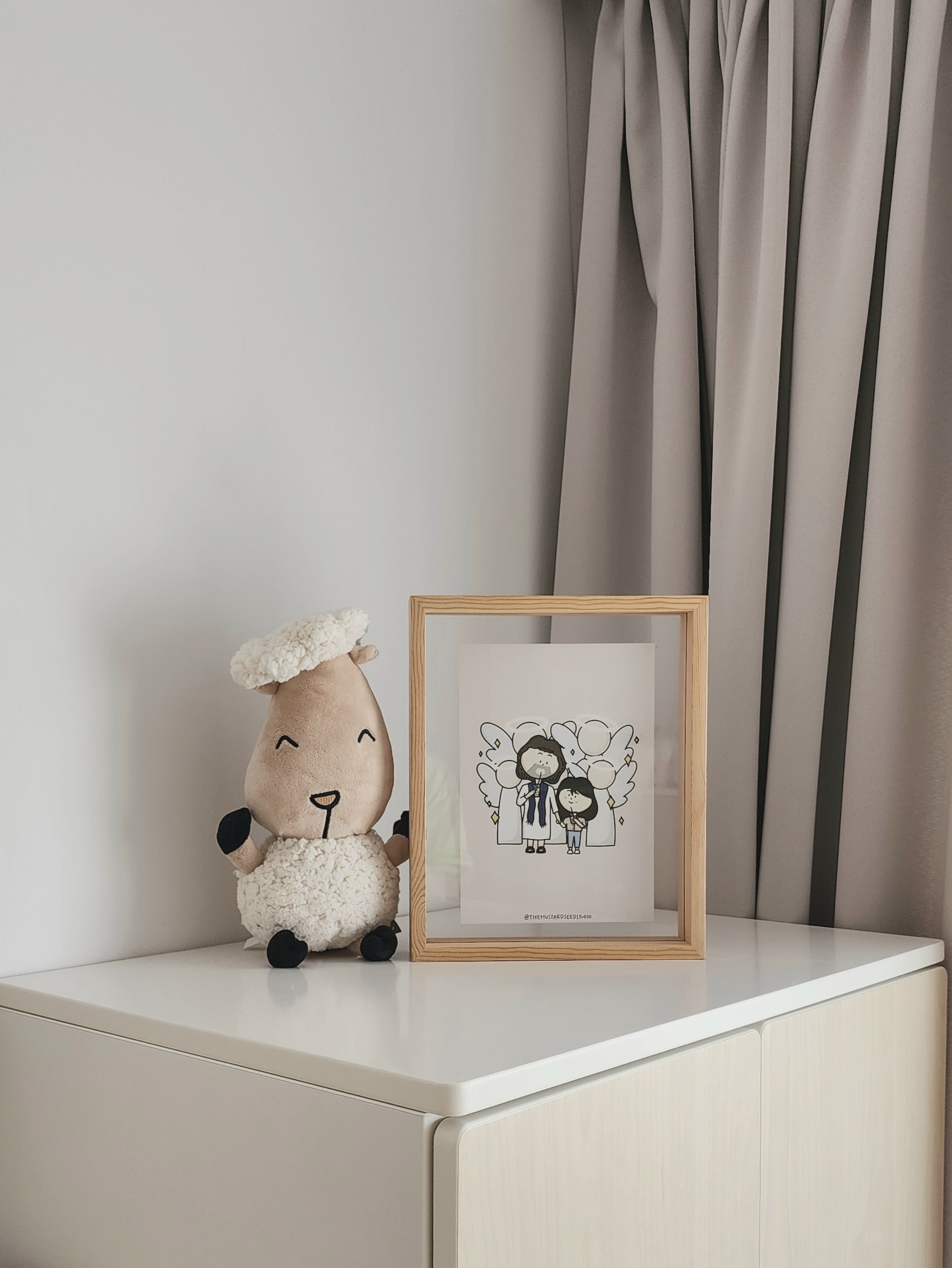 Our Kids Playroom: Where Fun Never Ends - Soft, plush, beige sheep toy with fluffy white wool, sitting on a white surface.