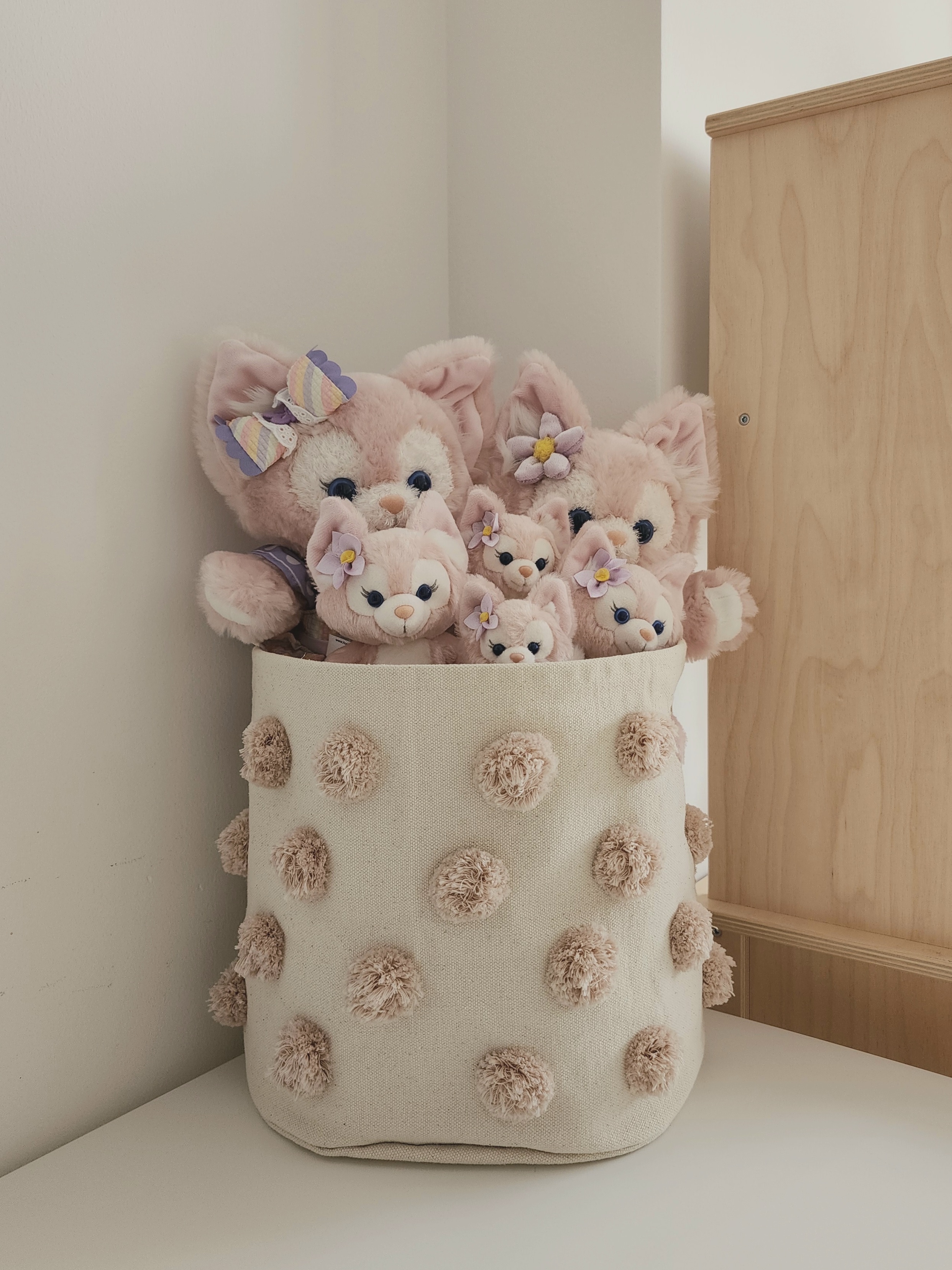 Our Kids Playroom: Where Fun Never Ends - Soft, pastel-colored plush toys with large ears and bows, nestled in a