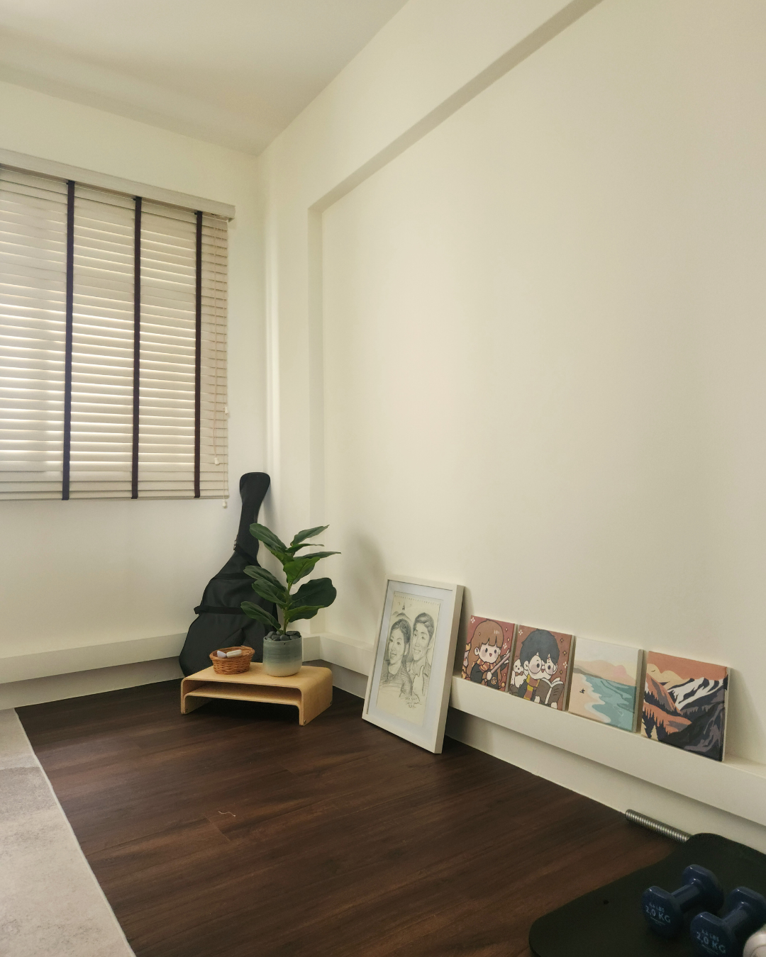 Personal Touches: Bringing Warmth to Our Guest Room - Wooden floor, minimalist decor, white walls, natural light, potted