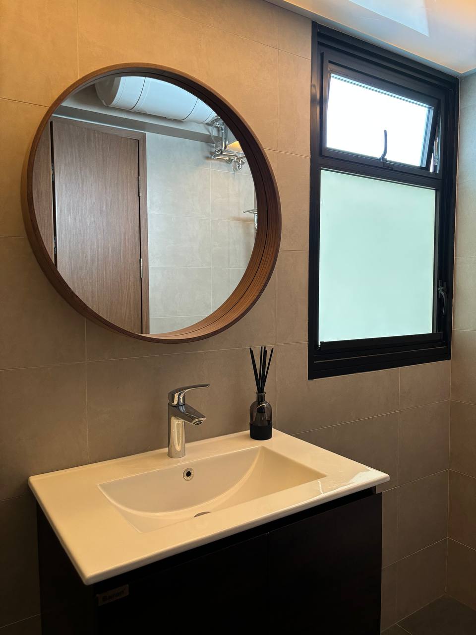 Resort style Bathrooms with HDB fittings under $2.8k - Round mirror, wooden frame, bathroom vanity, white sink, modern