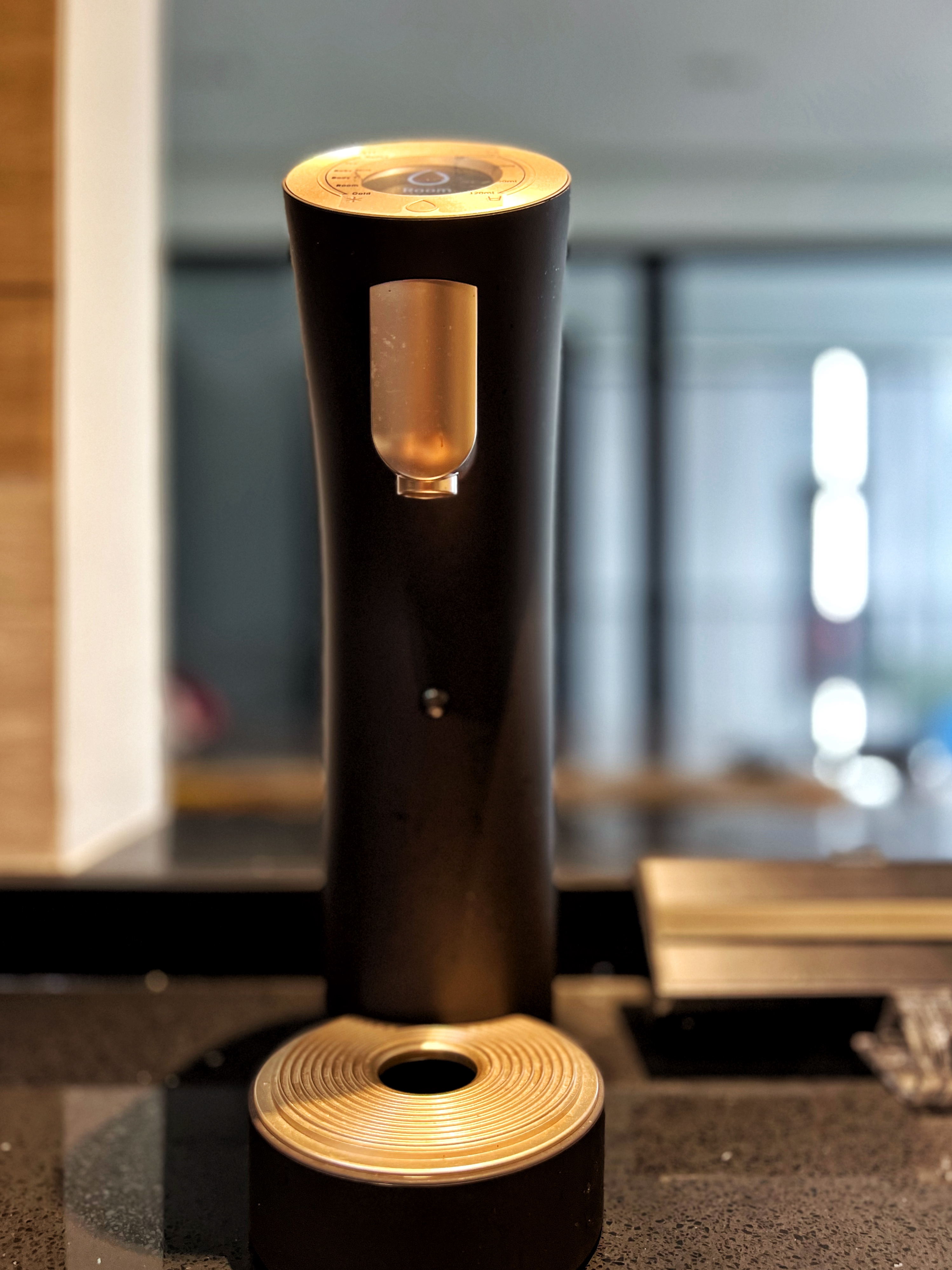Cooking is an Adventure and This is My Launchpad! - Modern cylindrical device, sleek design, metallic finish, black base