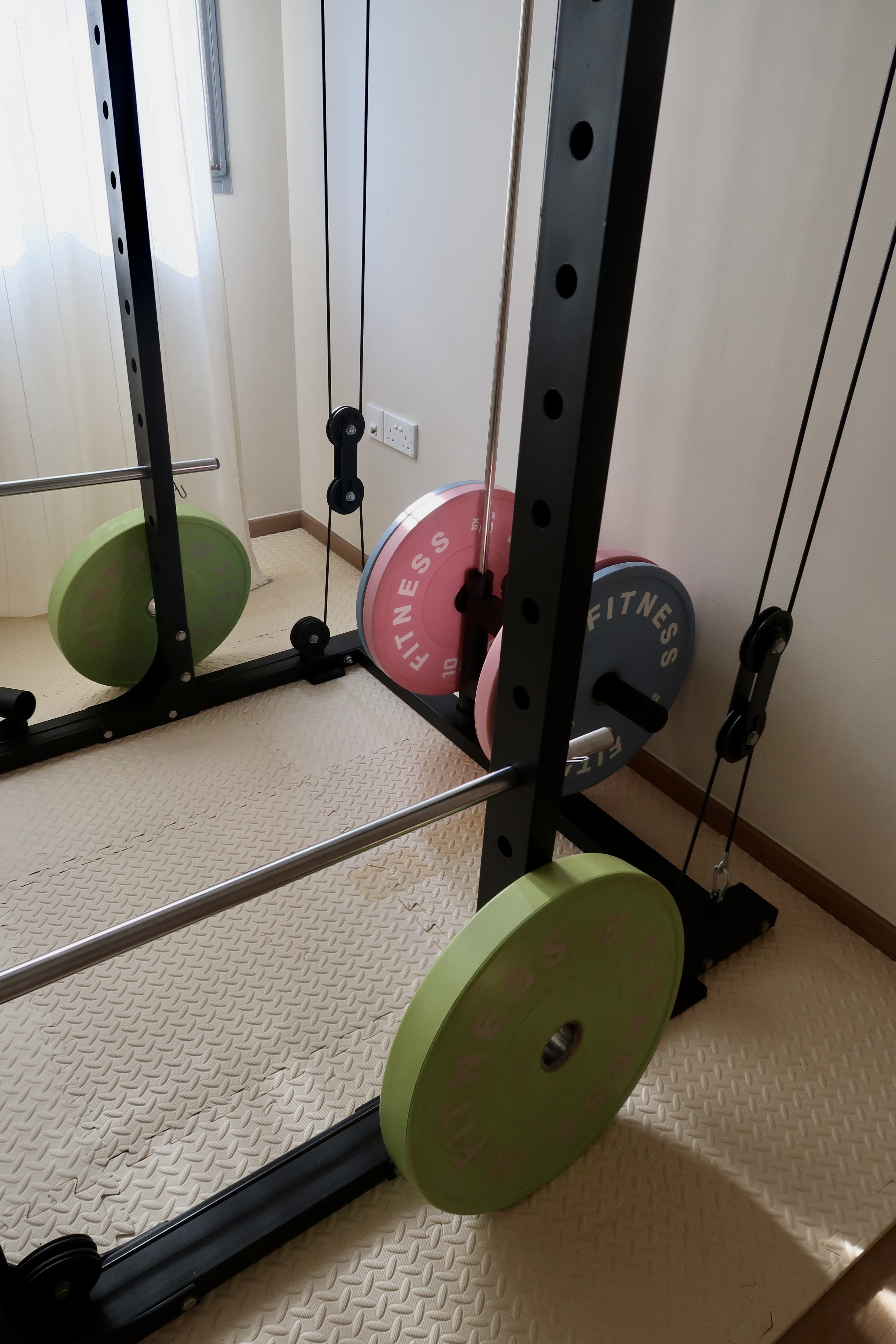 Under $1000 Home Gym: Versatile Gym Setup with Fun Colours! - Weightlifting equipment, barbell, green weight plates, pink