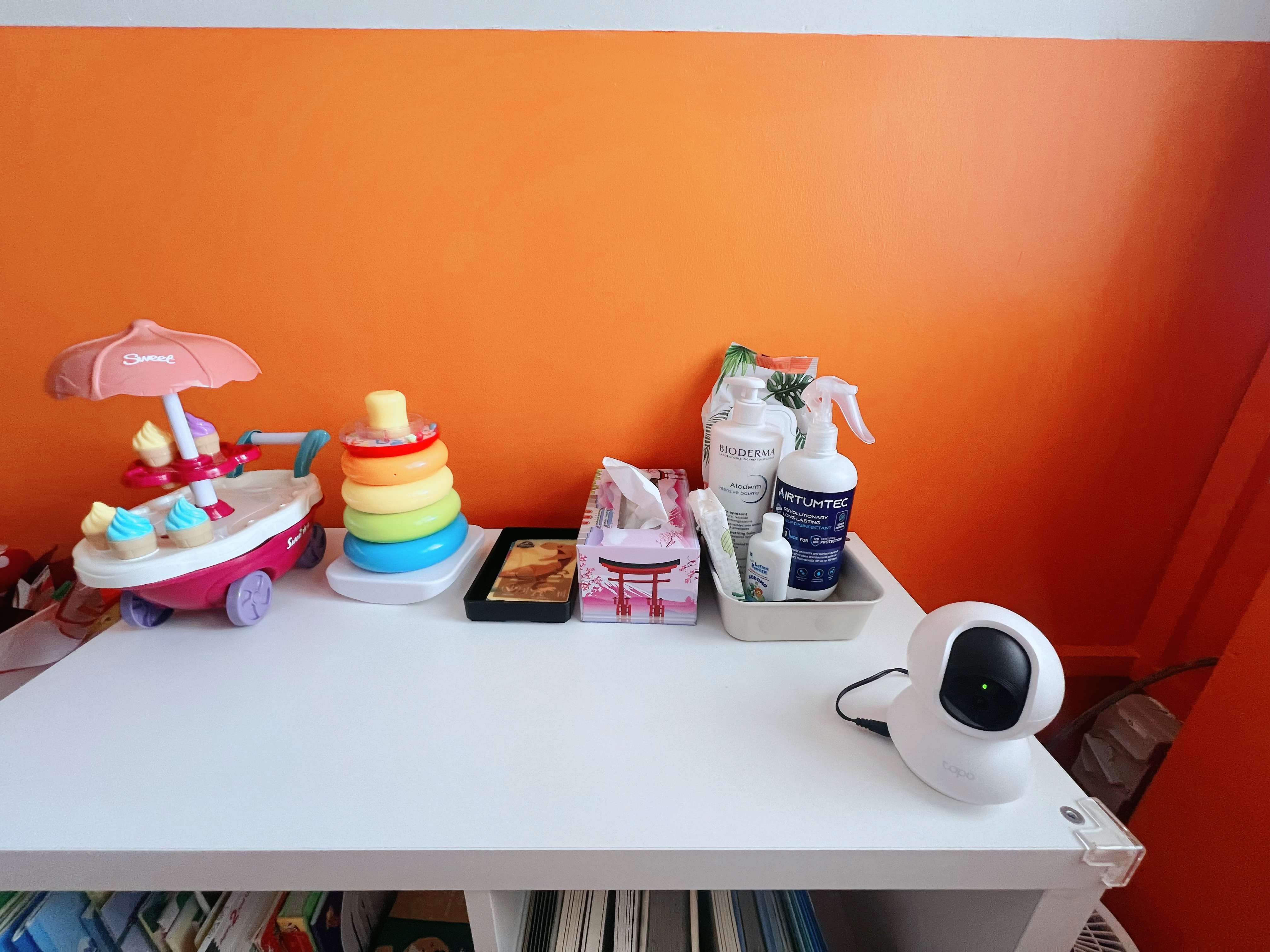 Playroom Pop: Bold Orange and a Rainbow of Fun!  - toy cart with ice cream cones, colorful toy car, pink umbrella, rainbow