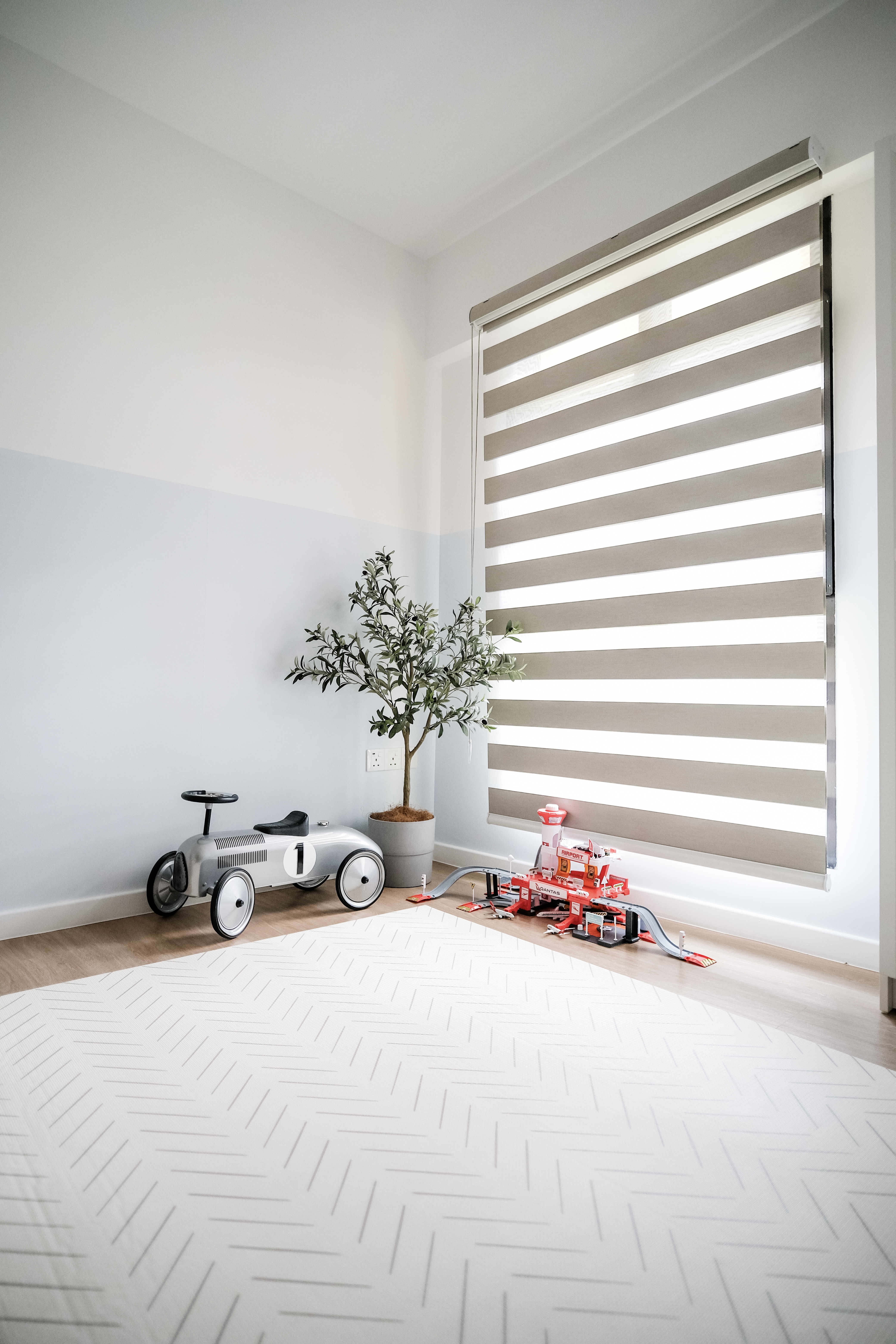 Playroom Design with Loose Furniture for Maximum Space and Flexibility - Children's toy car, white and silver, toy train set