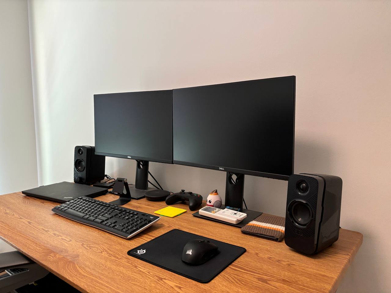 Half-glass Workspace with zero built-ins - Black dual monitor computer setup, sleek ergonomic desk, ergonomic keyboard and