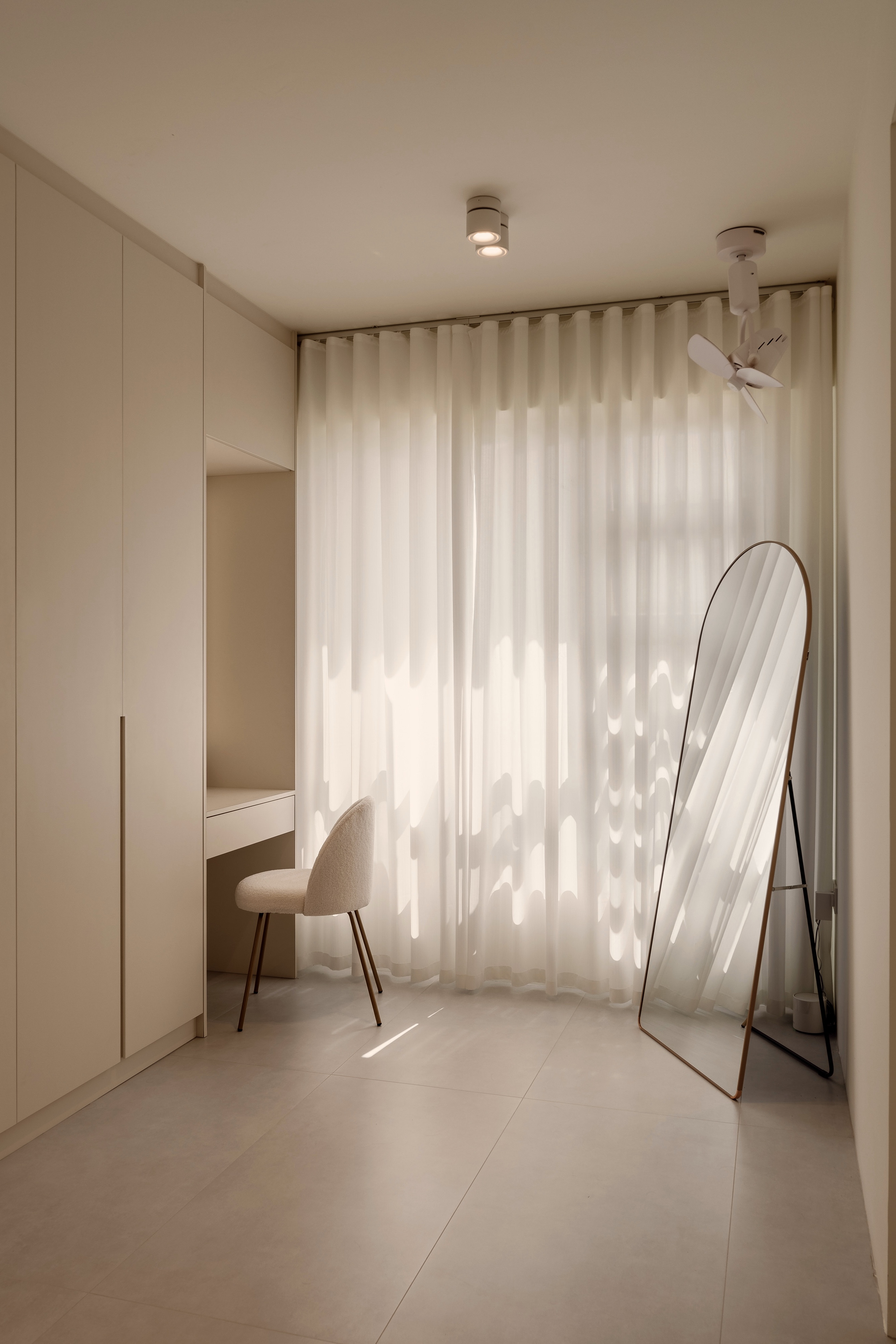 Designing My Ideal Wardrobe And Vanity Space - Minimalist room with beige walls and floor, soft natural light streaming