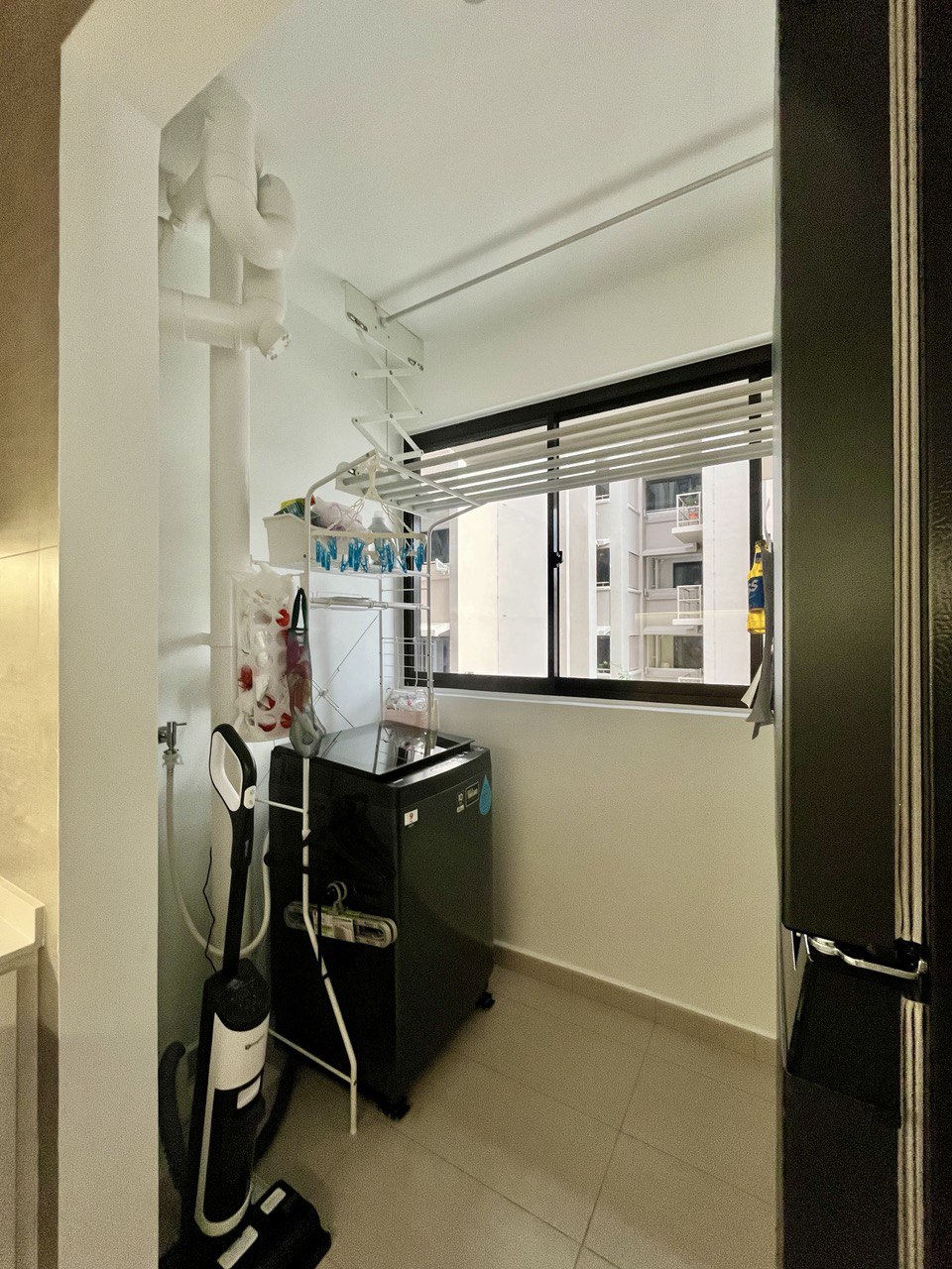 Carpentry-Free Service Yard with a Fridge in a 3-Room BTO - Dedicated laundry room, white tiled floor, black washing machine