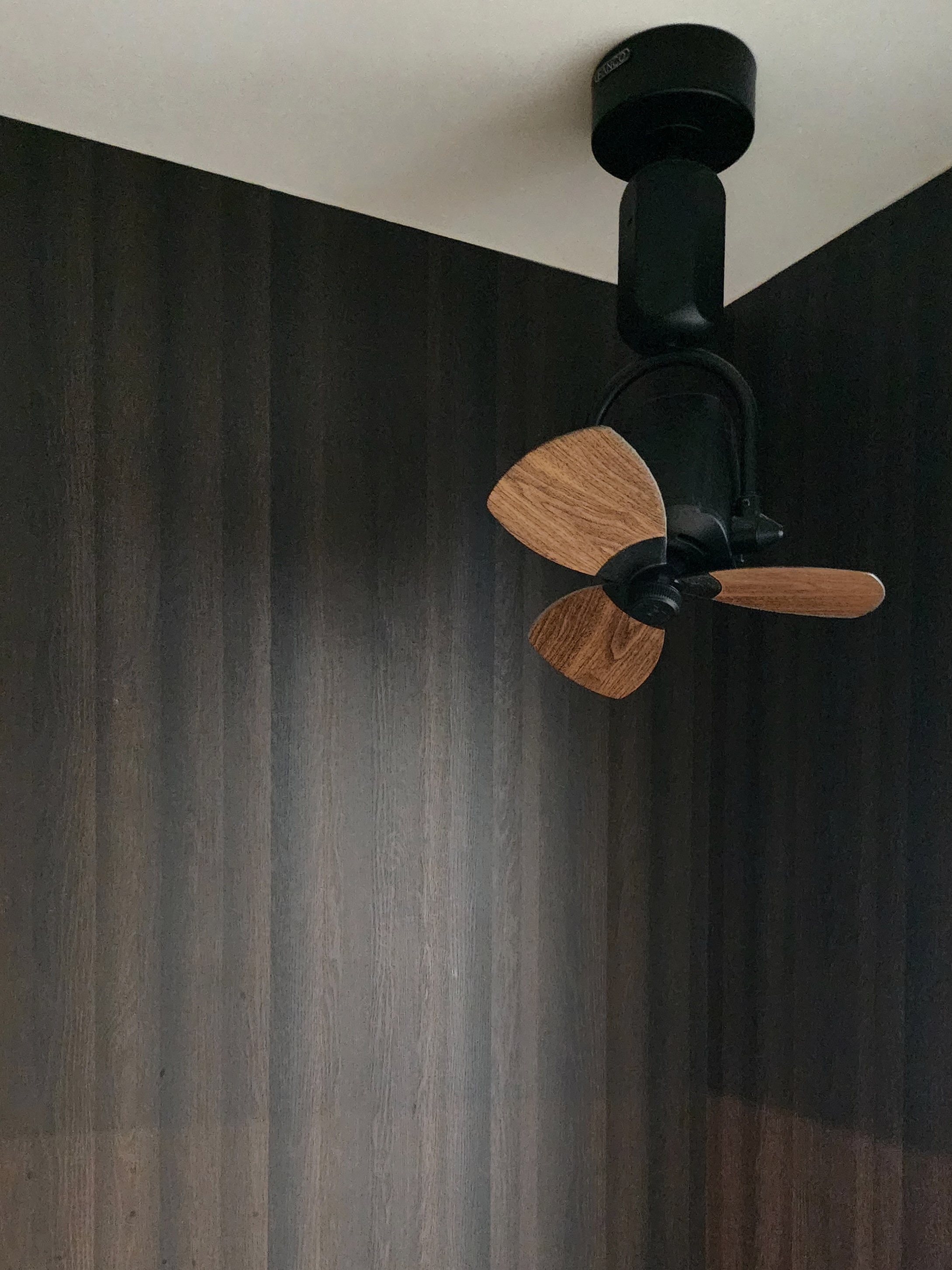 Our Closet Office: Small Space Big Impact - Wooden ceiling fan, black ceiling mount, dark wood wall, modern design, dual