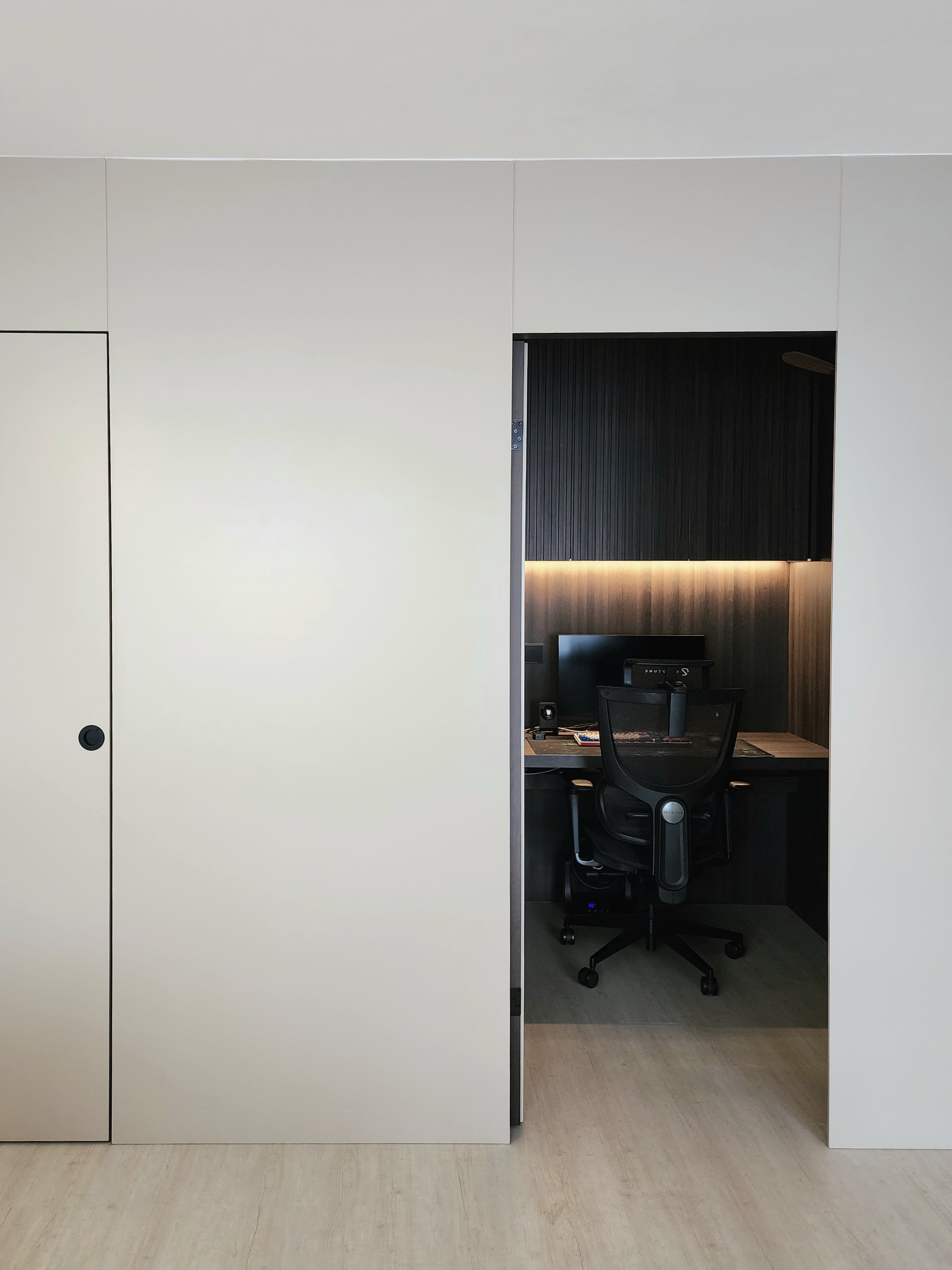 Our Closet Office: Small Space Big Impact - White minimalist wardrobe, modern office space, sleek desk, black office chair