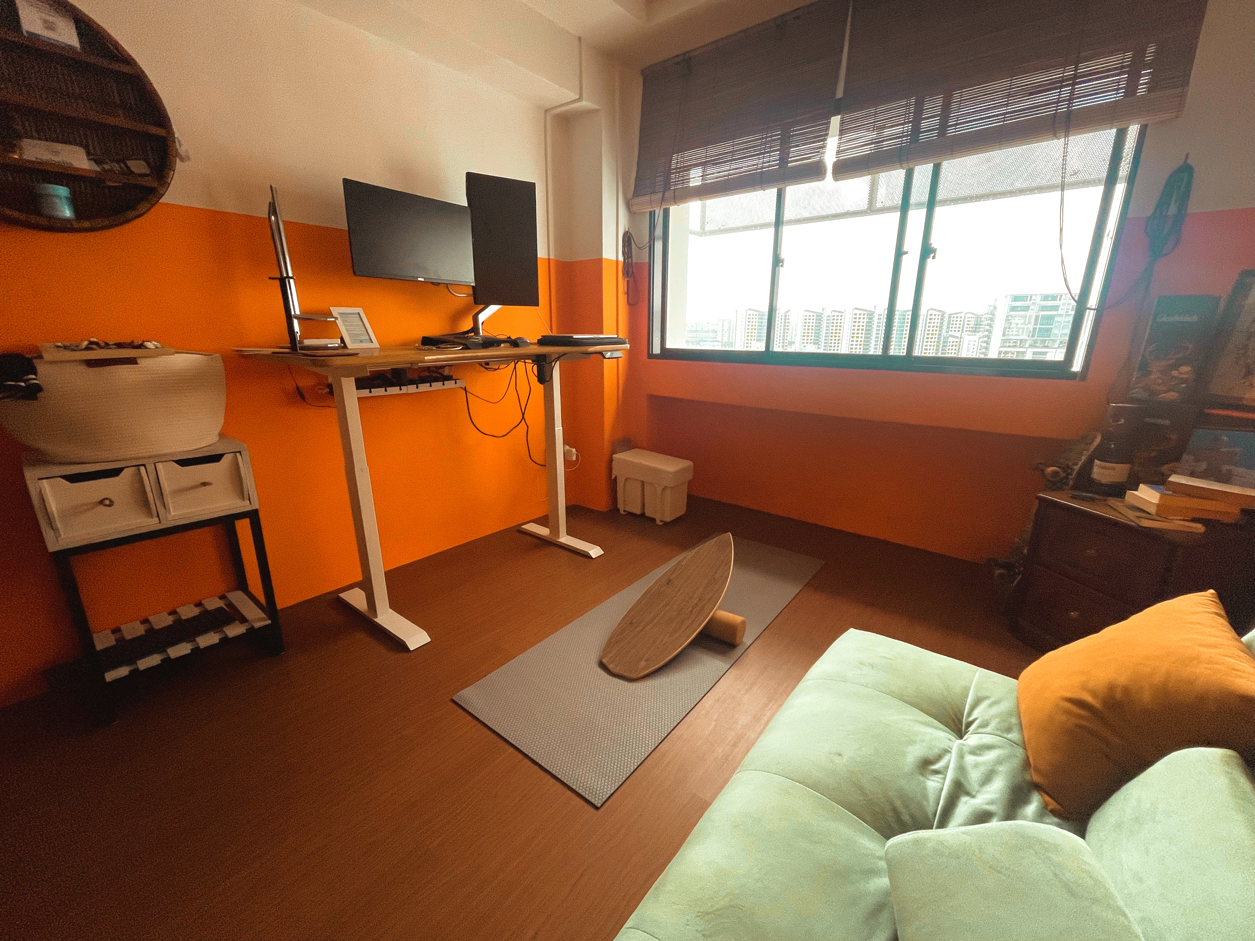 The Brightest Room in the House: A Space for Ultimate Productivity - Orange wall, modern desk, dual monitors, black speakers