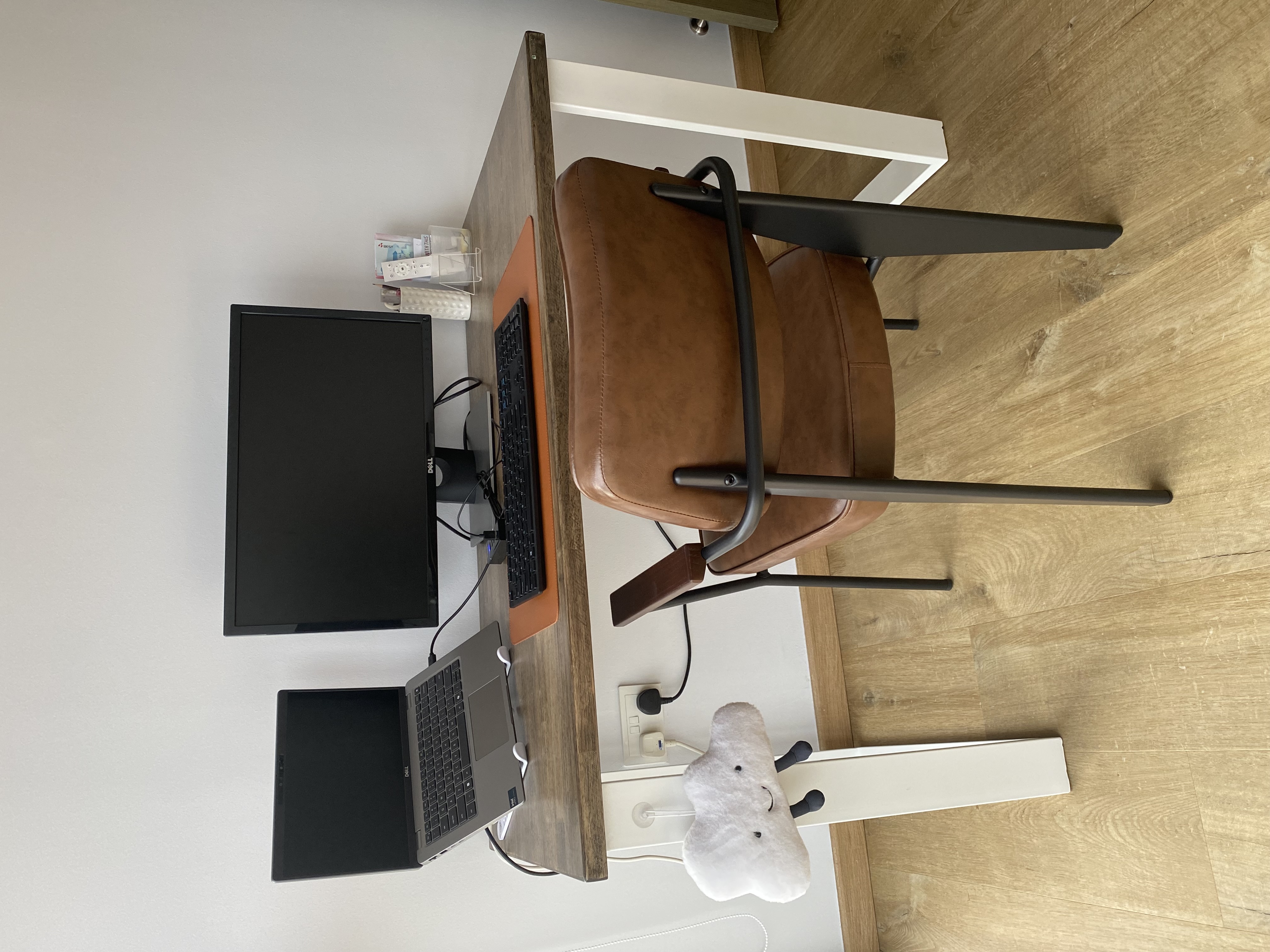 Minimalist work room for 2 with no built-ins - Modern workspace, ergonomic chair, brown leather chair, black monitor, black