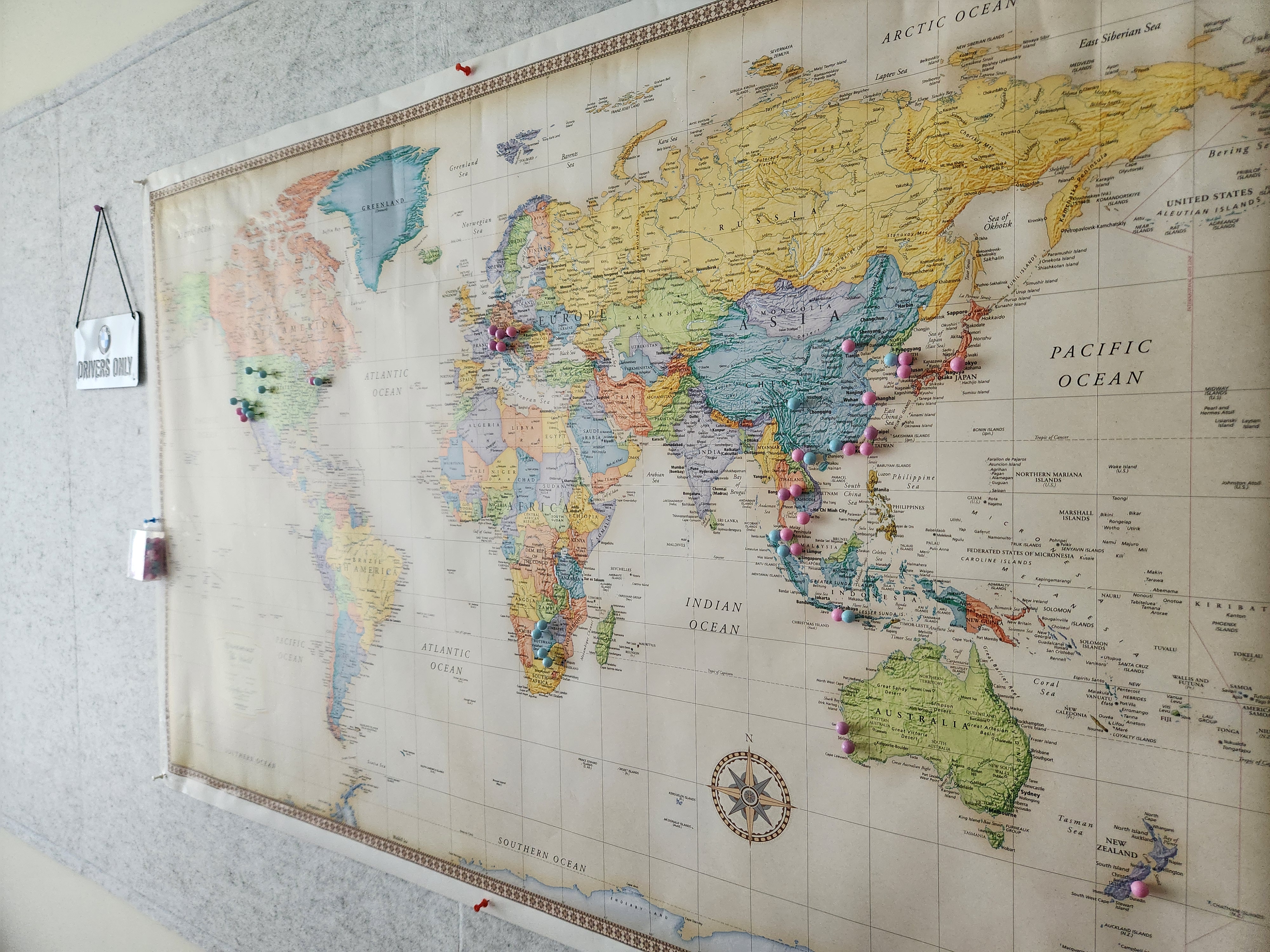 2-in-1: Our Recreational Guest Room - Historic world map with colorful pin markers, Detailed world map with various ocean