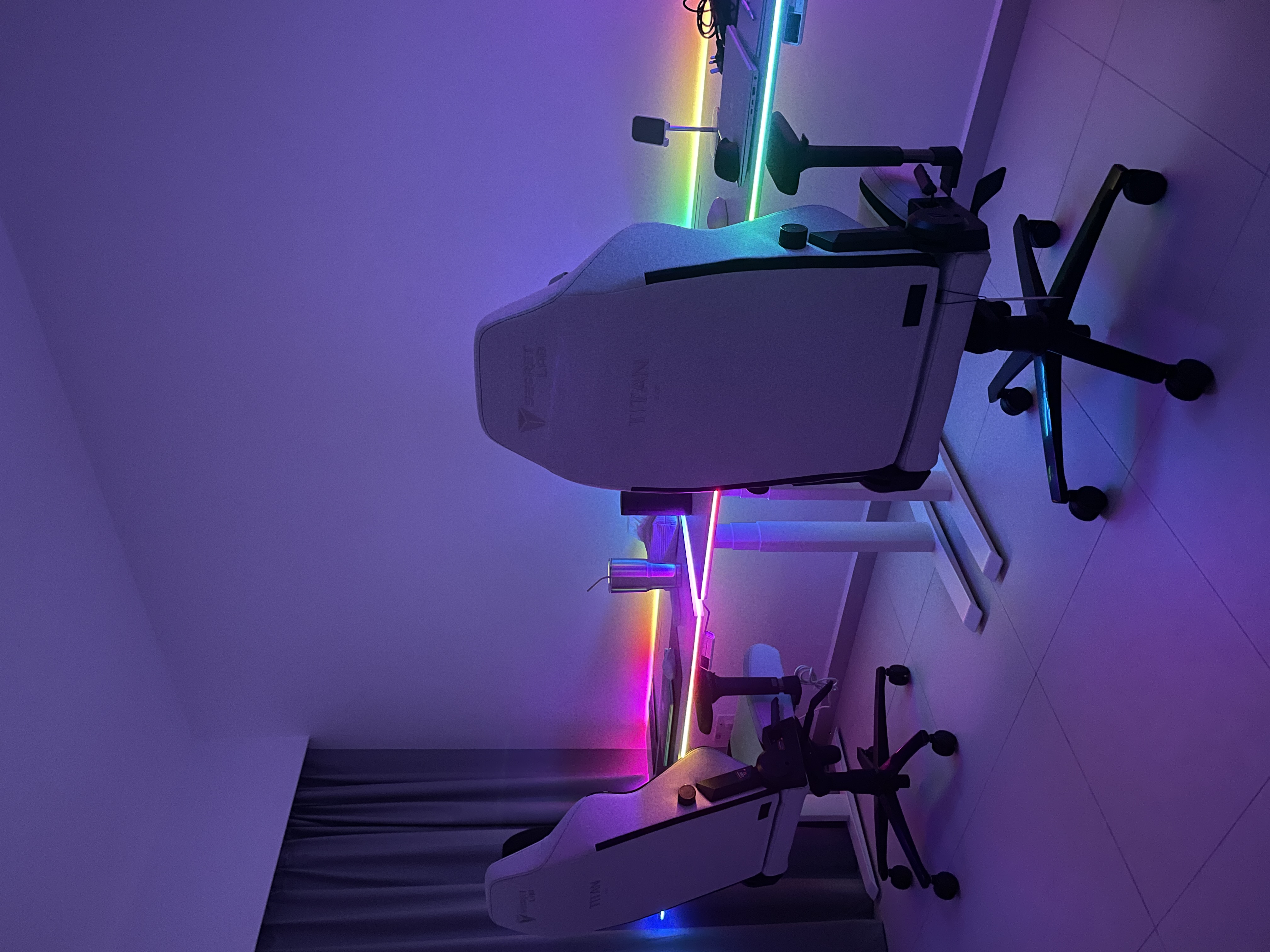 Home Workspace: The Ultimate RGB Study Room  - Purple-lit room, futuristic setup, ergonomic chairs, VR equipment, neon
