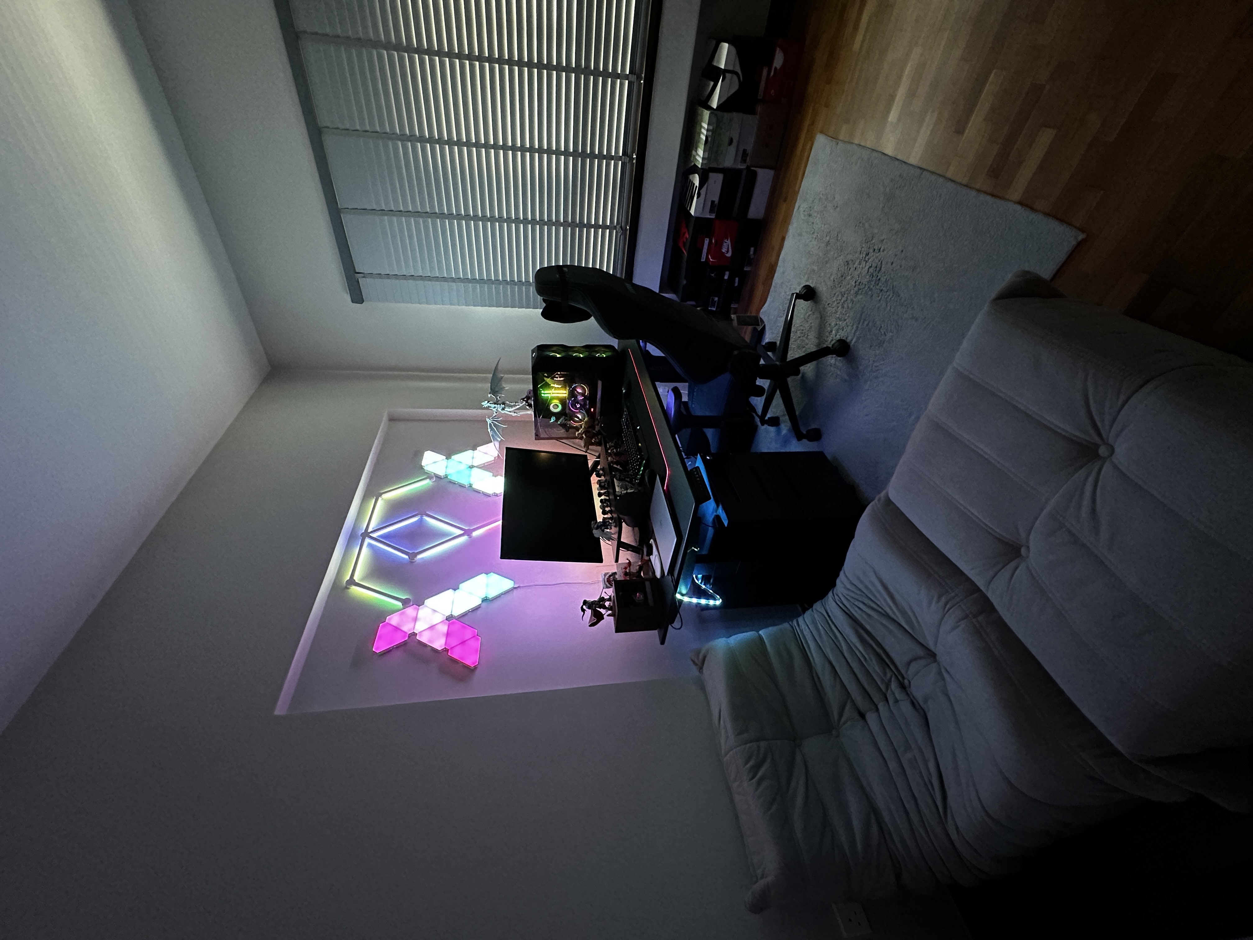 Our study room with a shoe collection and zero built-ins!  - Sleek, modern workspace with vibrant LED lighting, Gaming setup