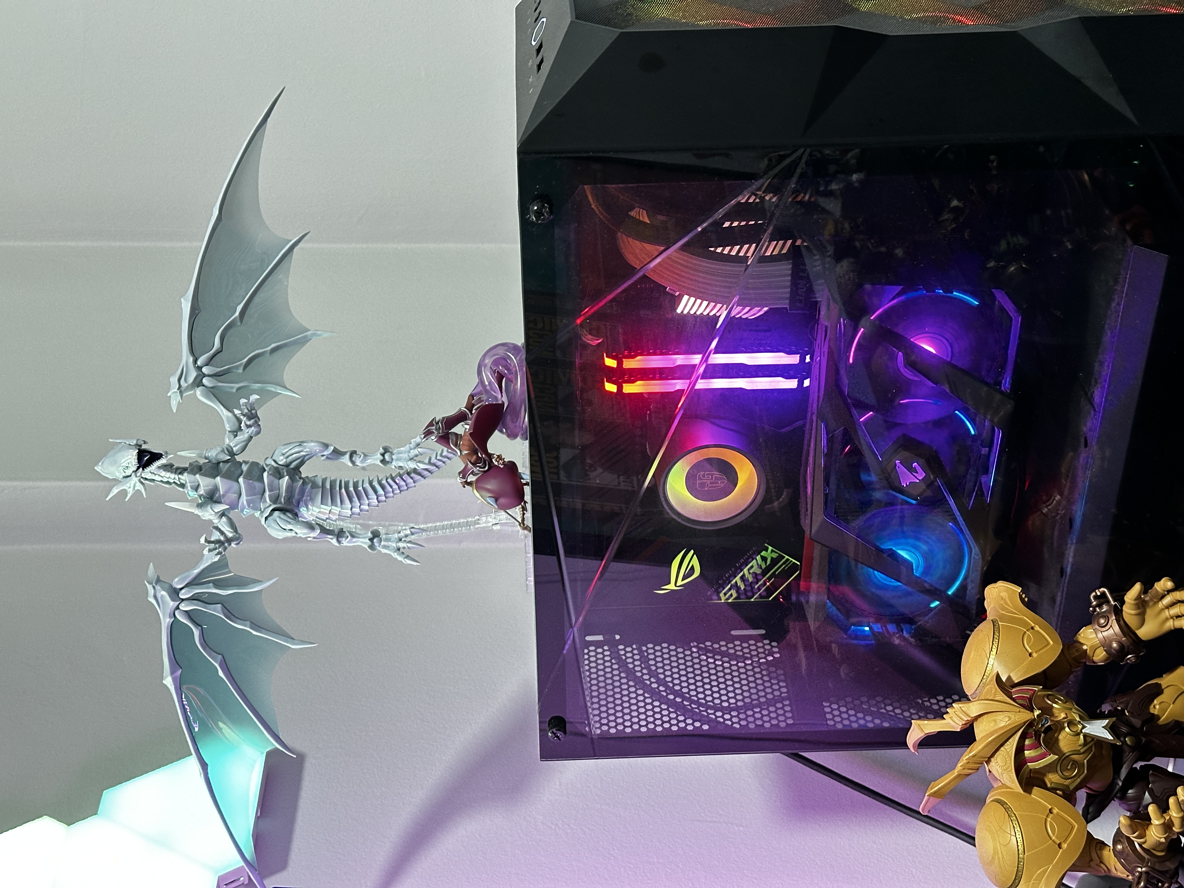 Our study room with a shoe collection and zero built-ins!  - Sleek, modern gaming PC with vibrant RGB lighting, Detailed