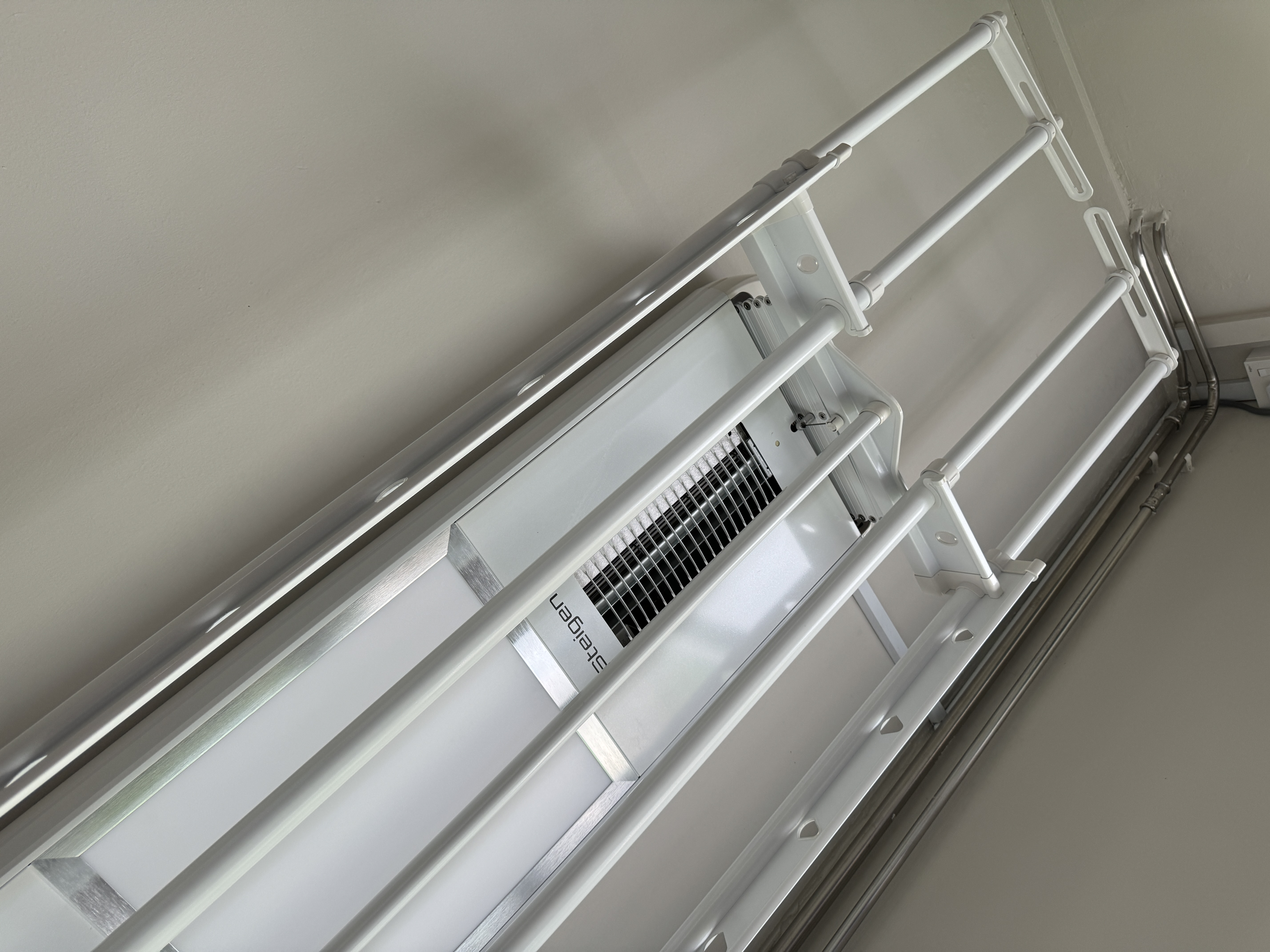 Top Investments for Modern Living - White ladder, metal frame, wall-mounted, corner rail, ventilation duct, air conditioning