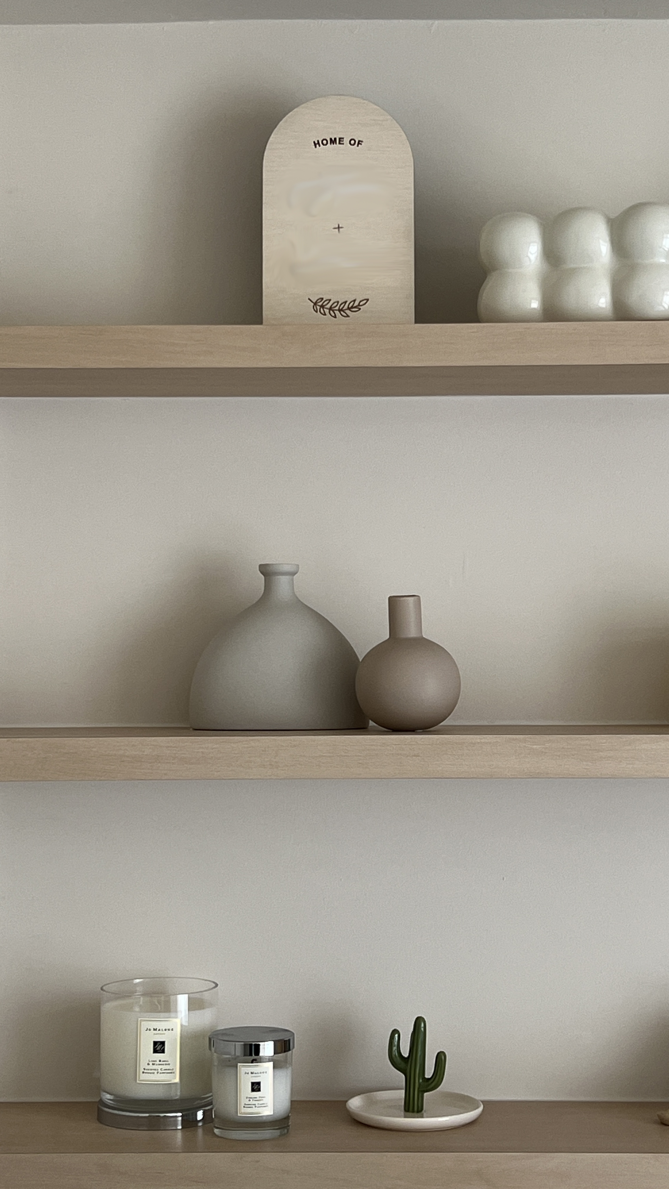 The Guest Room: A Cozy Retreat - Candles, minimalist, home decor, wooden shelves, modern design, soft lighting, earthy tones