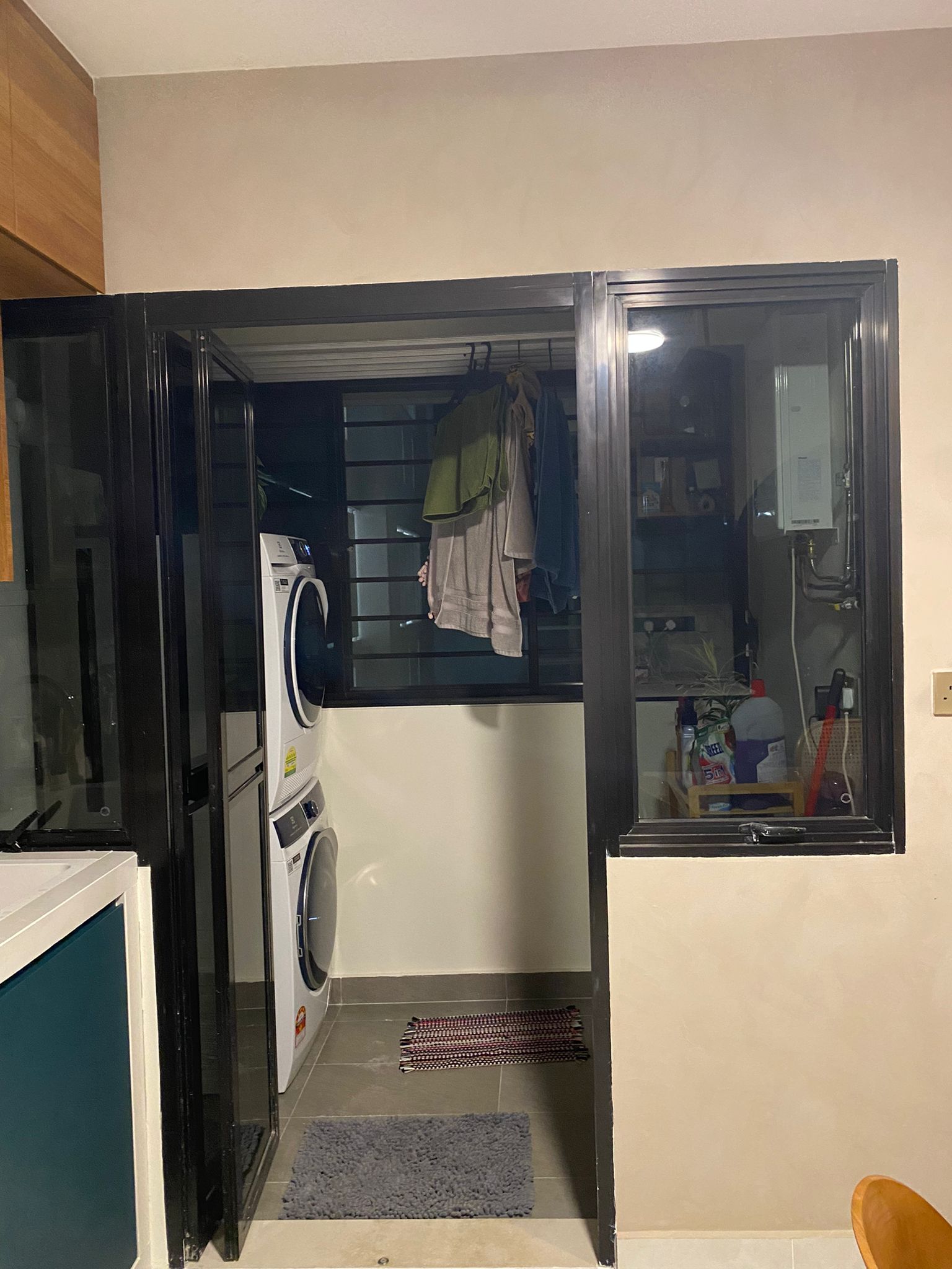 Service yard kept simple, functional and aesthetically pleasing - Washing machine and dryer inside, laundry room, open door