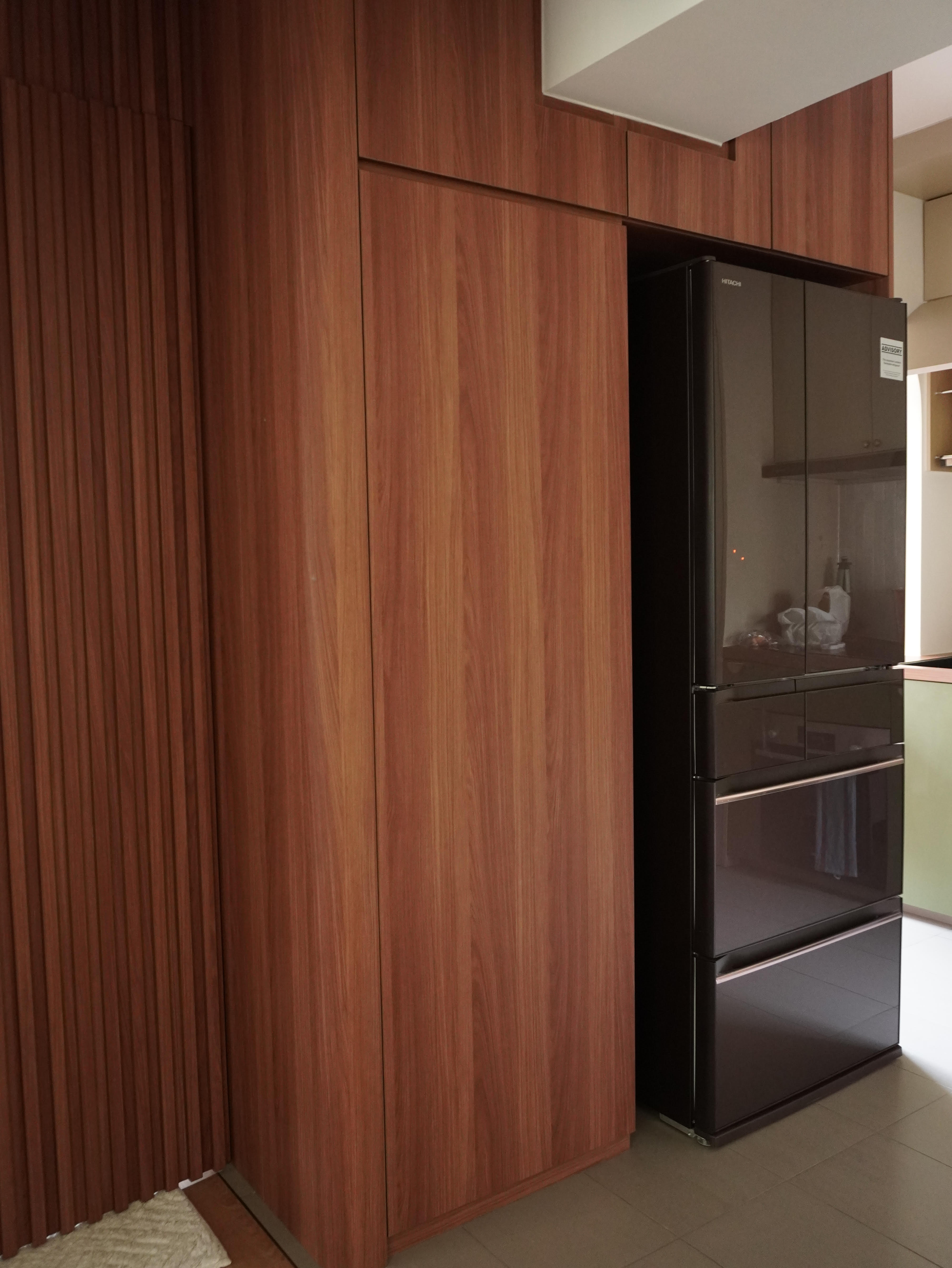 Keeping the clutter away in our Kitchen! - Wooden cabinetry, sleek refrigerator, modern kitchen, dark brown wood, vertical