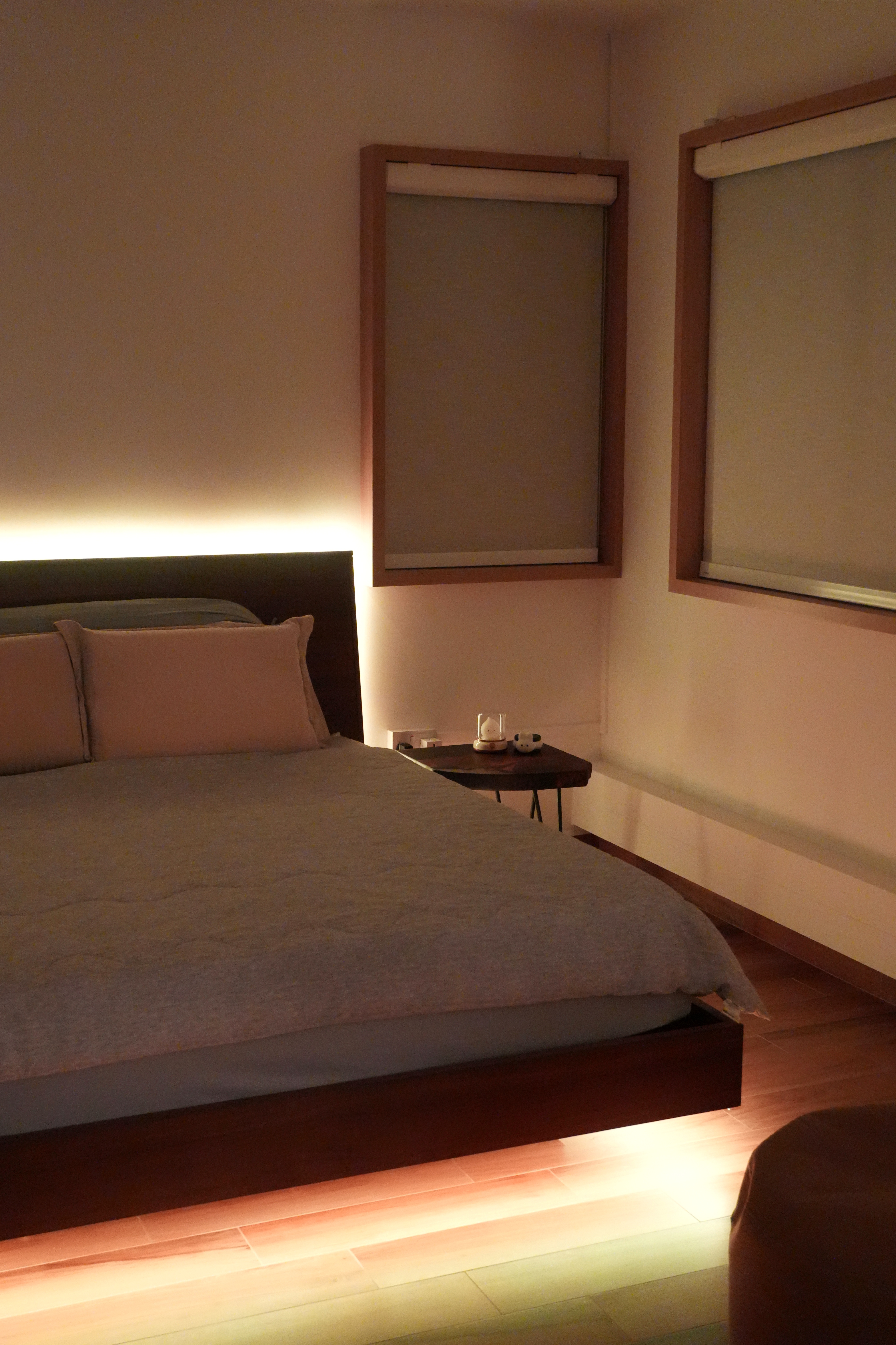 Transform your bedroom with this DIY ‘Floating Bed’ light trick! - dimly lit bedroom, bedside table, soft ambient light