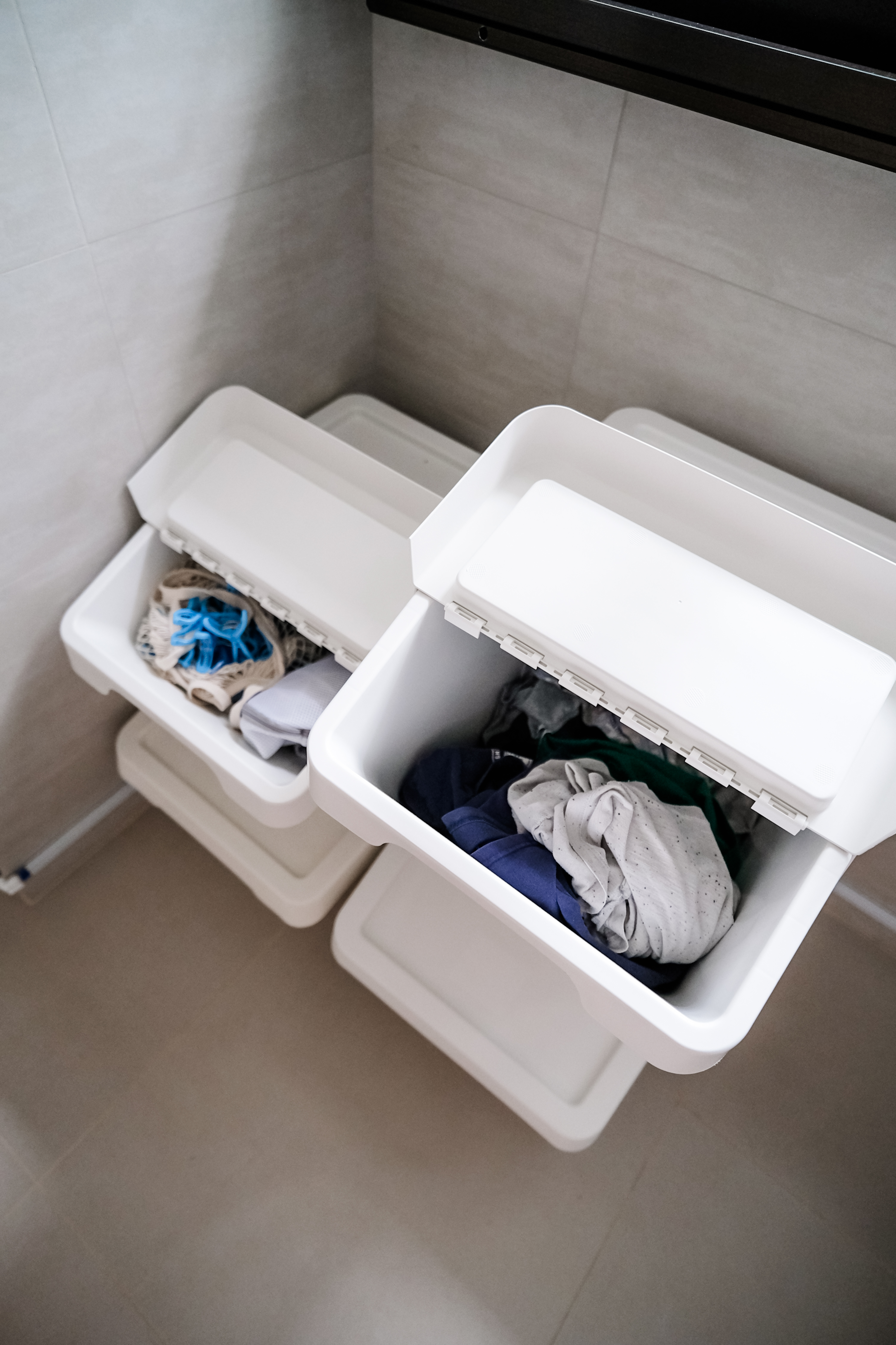Maximizing Functionality: The Ultimate Compact Service Yard - white laundry basket, open laundry bin, neatly folded clothes