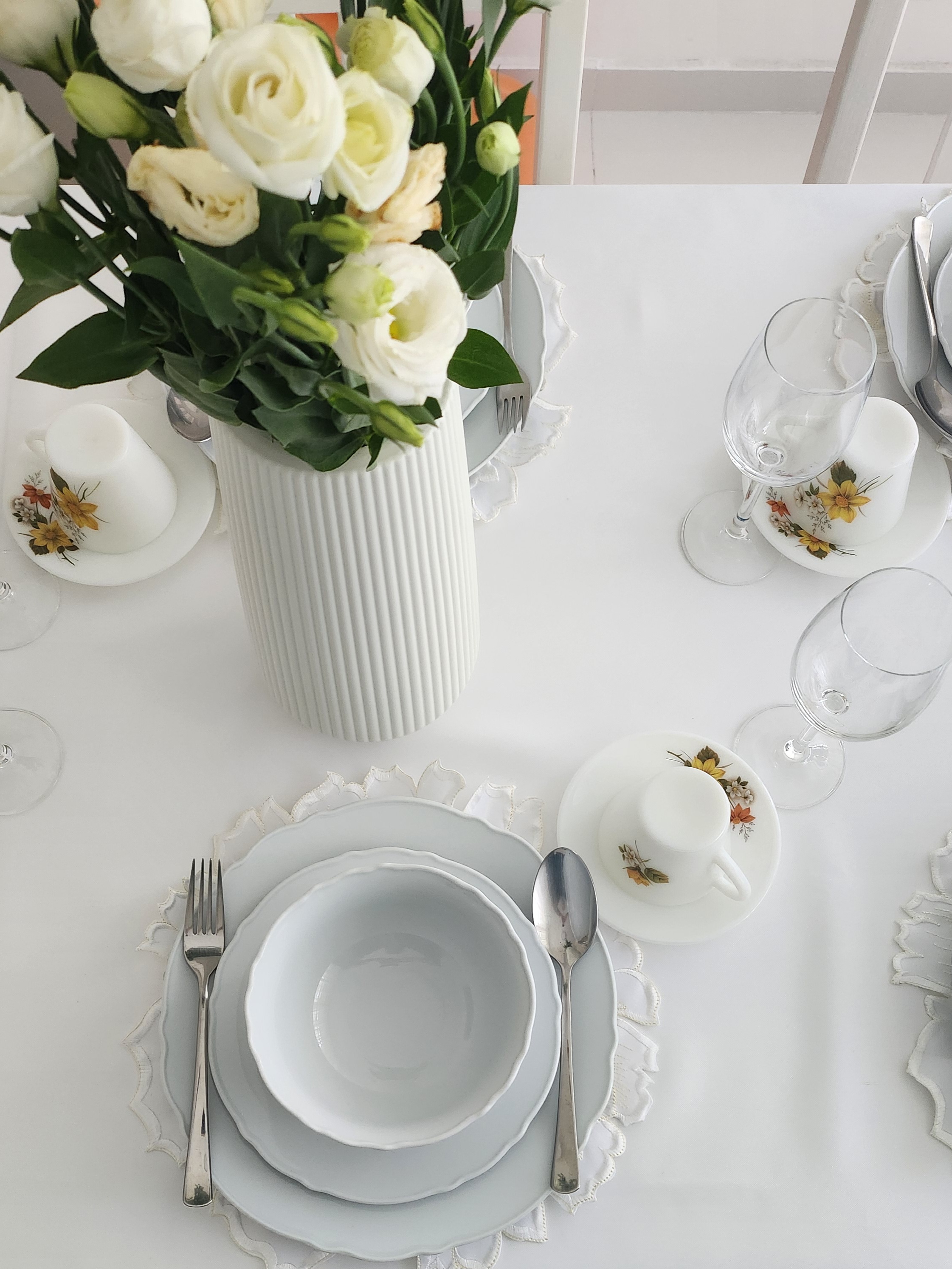 Aesthetics by punggoHField - vase, white table, elegant table setting, floral centerpiece, white plates, silverware, empty