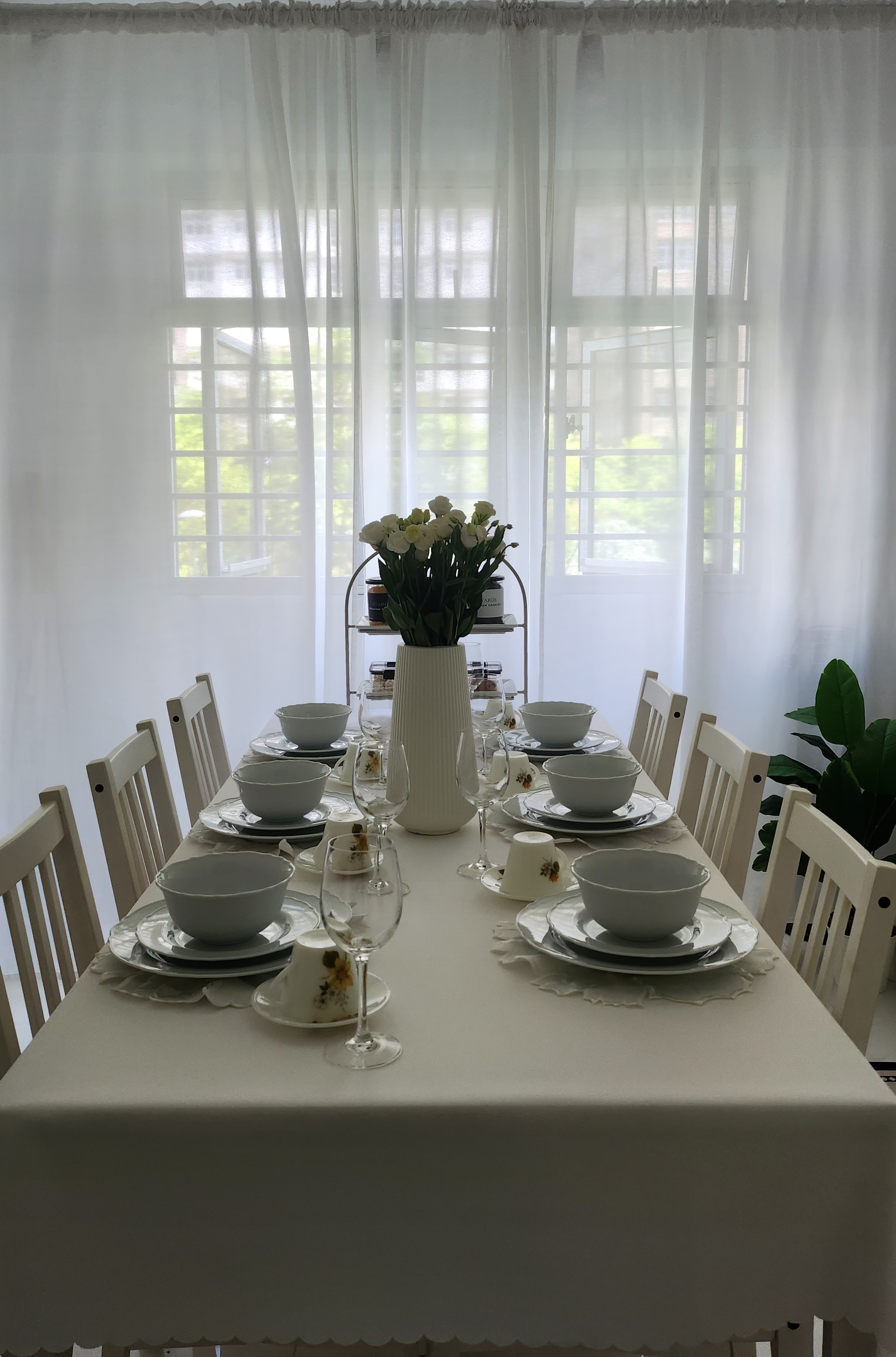 Aesthetics by punggoHField - White dining table, elegant table setting, floral centerpiece, sheer curtains, natural light