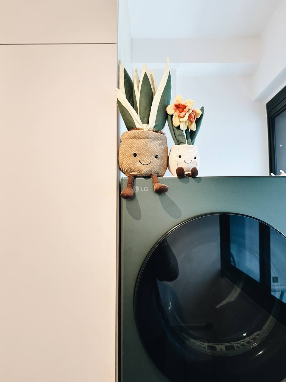 Our Service Yard: Laundry cabinet goals!  - Lush, green plants add a touch of nature to the modern laundry room., Soft, plush