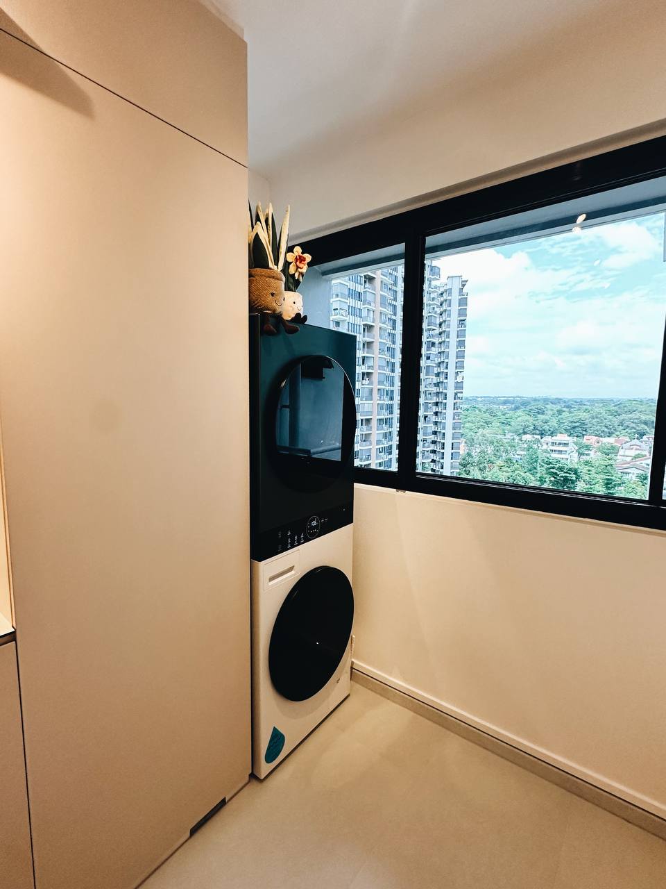 Our Service Yard: Laundry cabinet goals!  - Modern laundry room with sleek design, built-in washer and dryer, large window