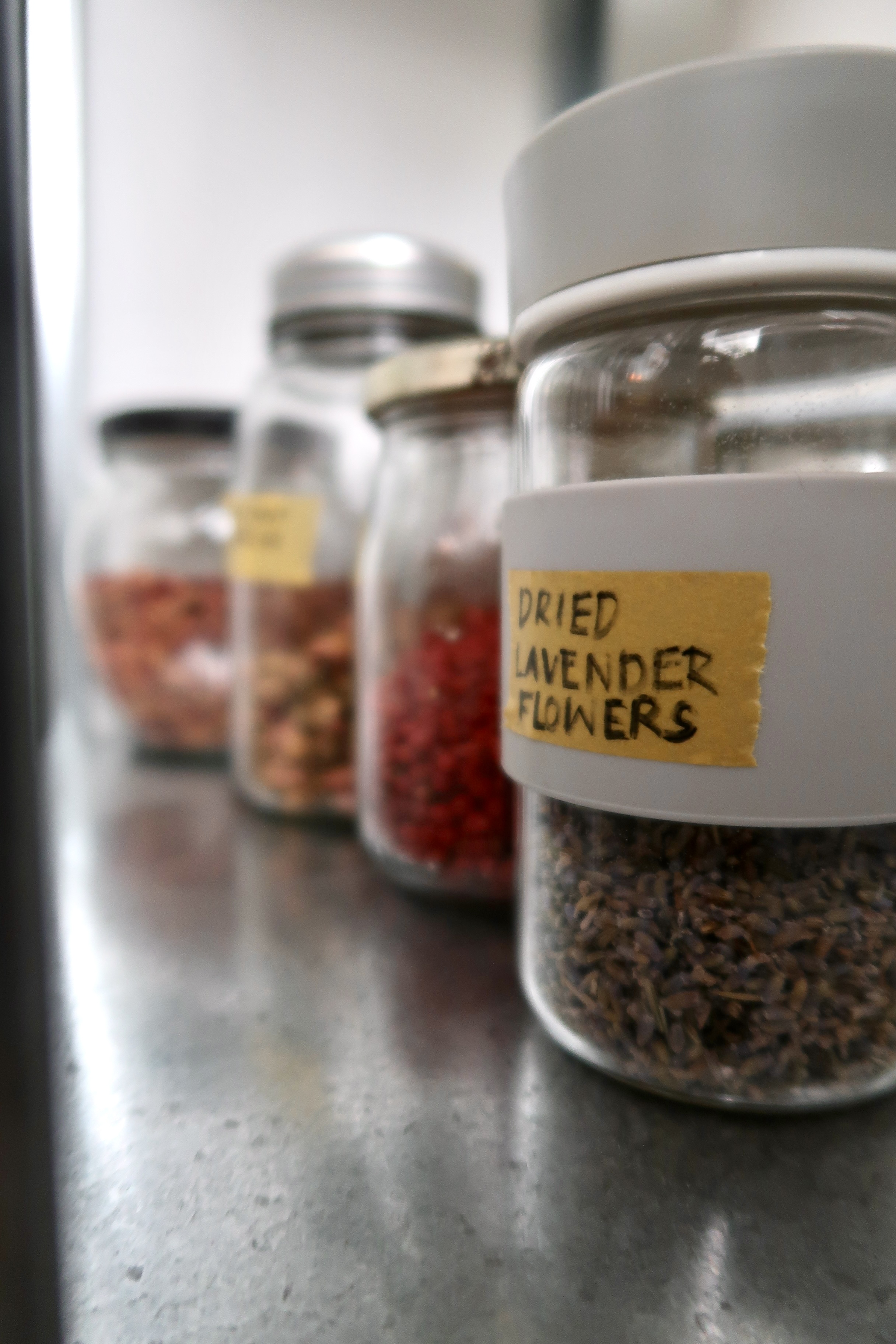 Multi-Use Service Yard with a Fermentation Nook  - glass jar with dried lavender flowers, labeled "Dried Lavender Flowers, "